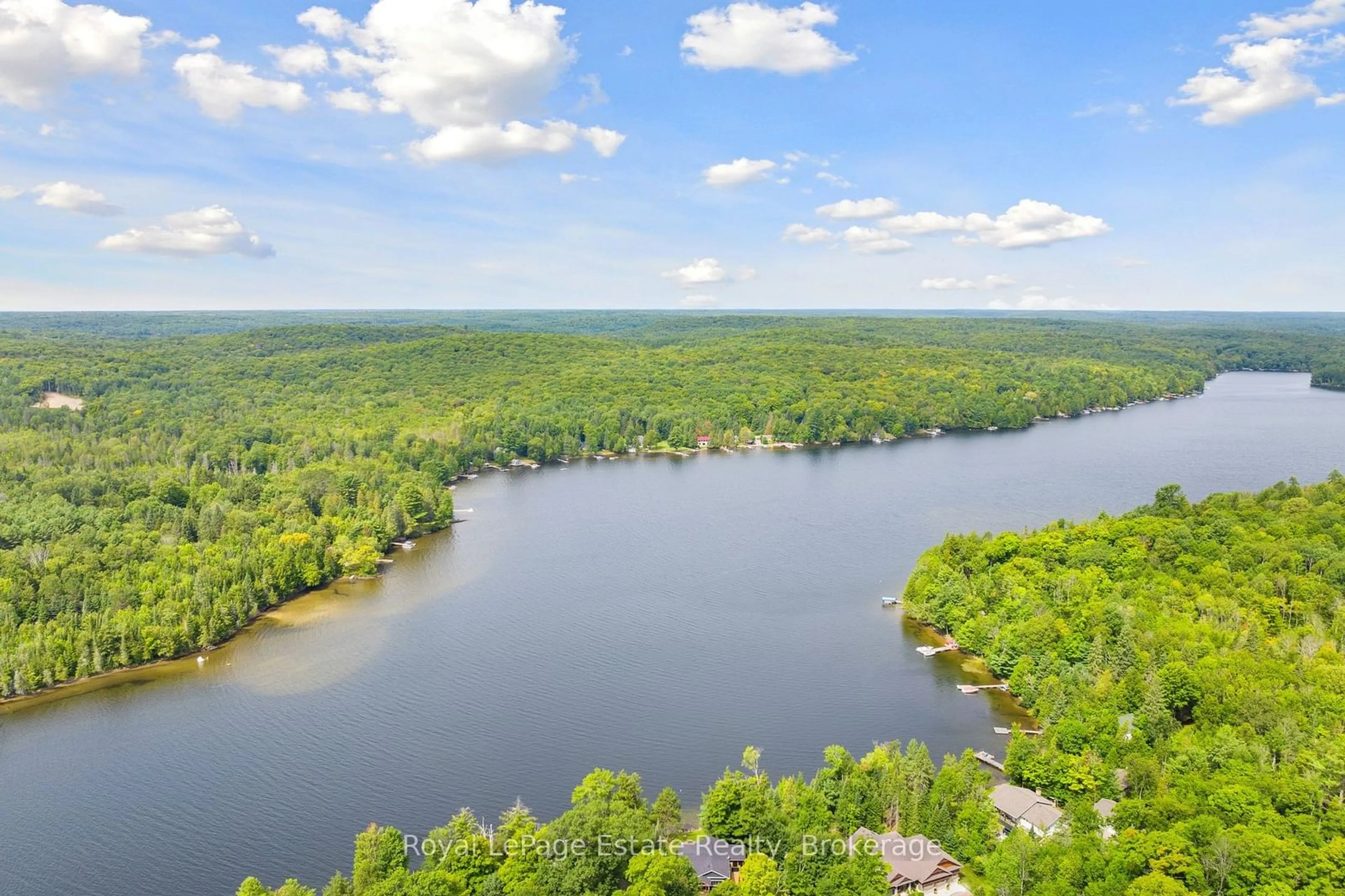 A pic from outside/outdoor area/front of a property/back of a property/a pic from drone, water/lake/river/ocean view for 1083 Surf Tr, Minden Hills Ontario K0M 2K0