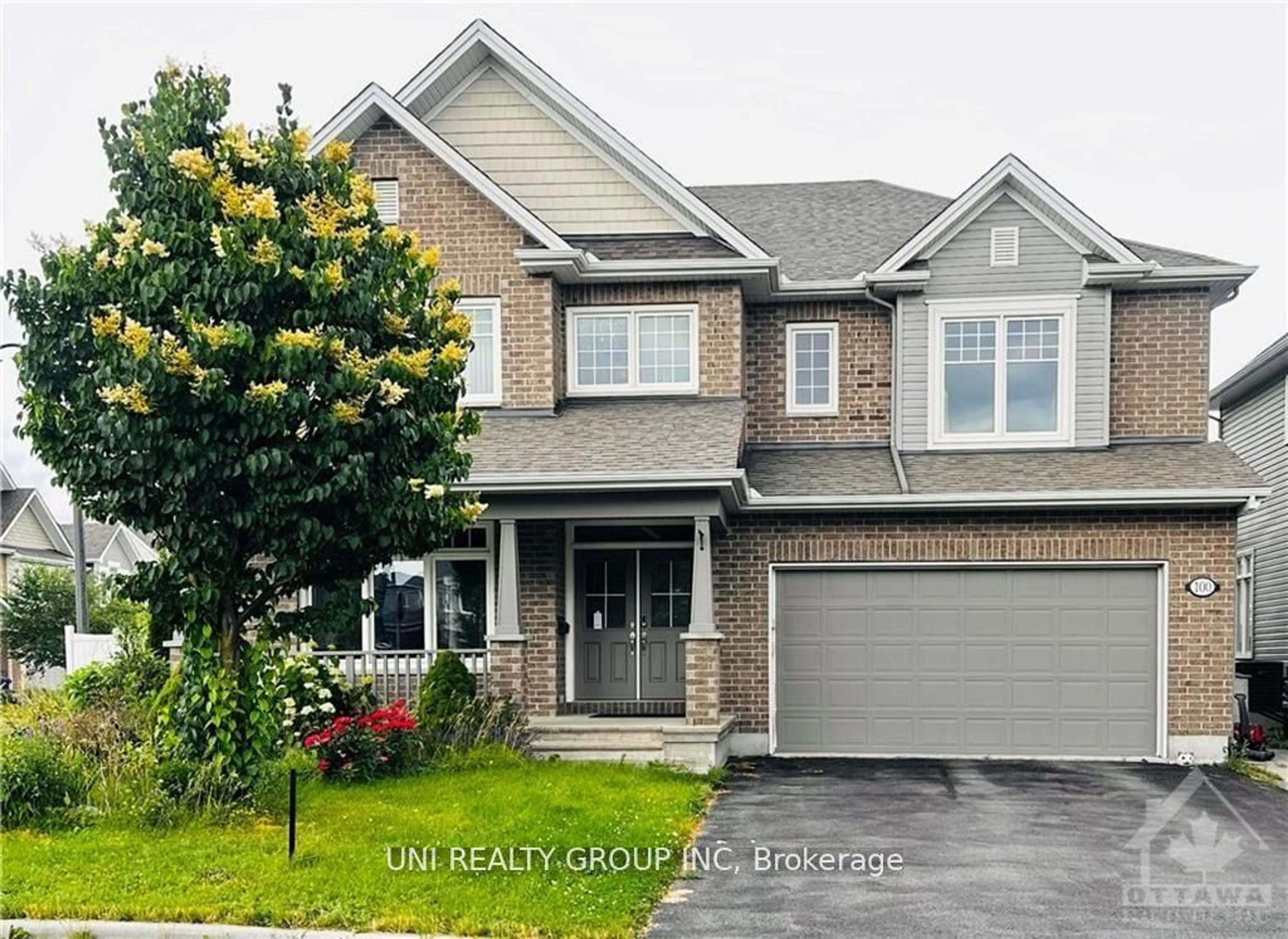 Home with brick exterior material, street for 100 BRAMBLING Way, Barrhaven Ontario K2J 5V3