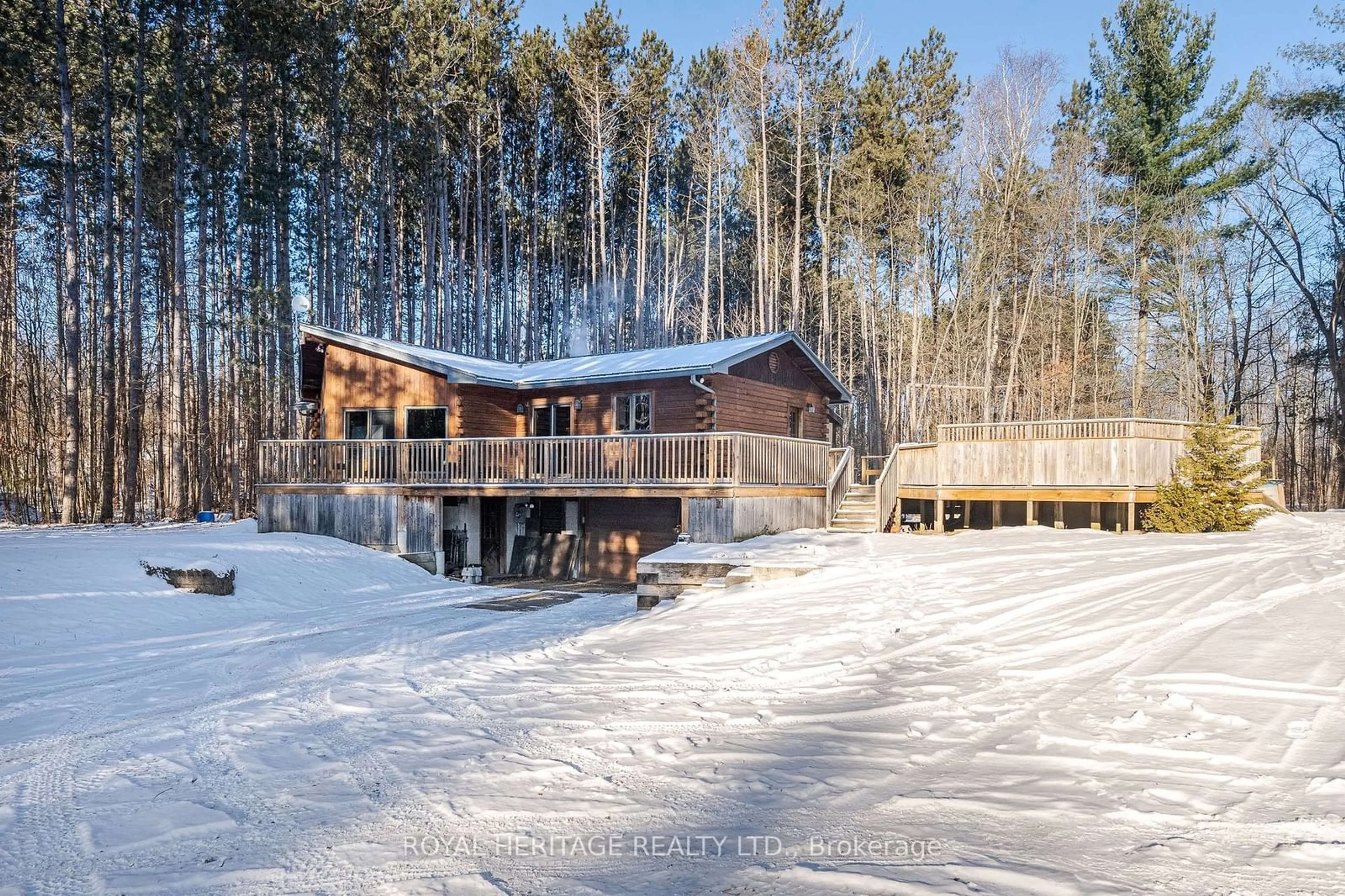 A pic from outside/outdoor area/front of a property/back of a property/a pic from drone, forest/trees view for 19 Mccrea Crt, Tweed Ontario K0K 3J0