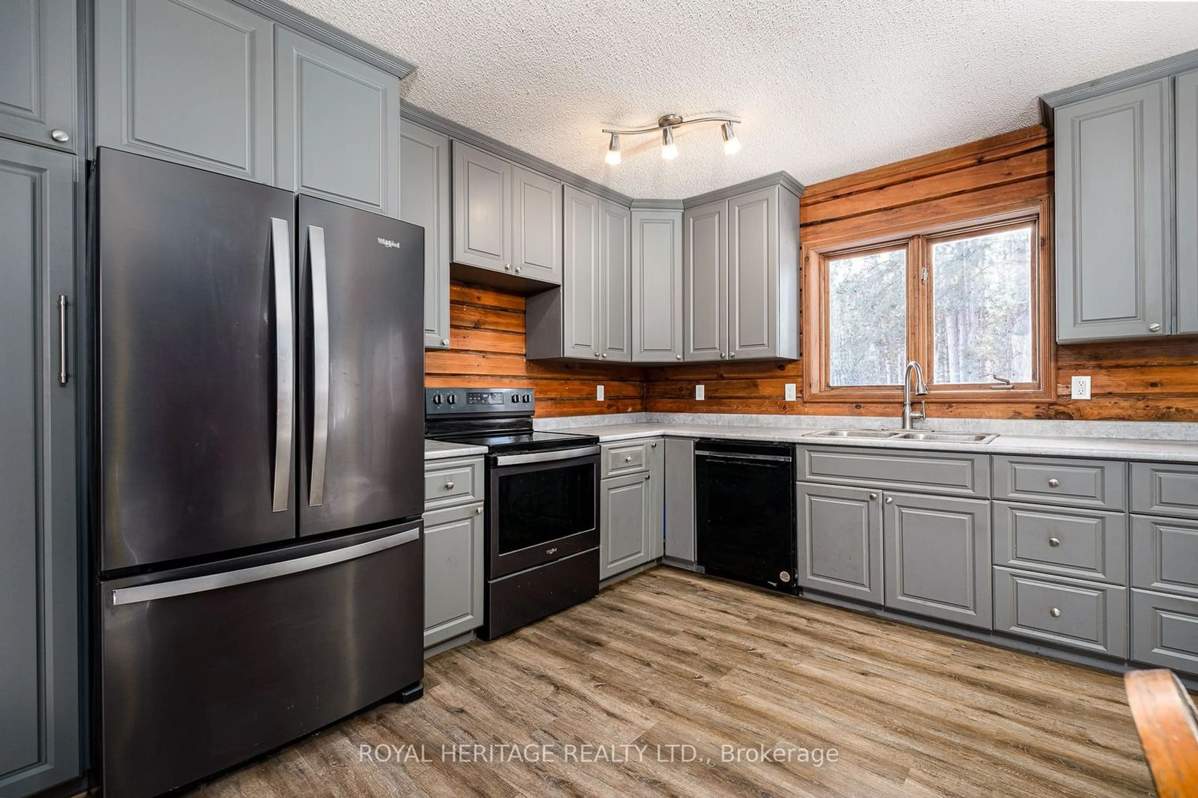 Open concept kitchen, wood/laminate floor for 19 Mccrea Crt, Tweed Ontario K0K 3J0