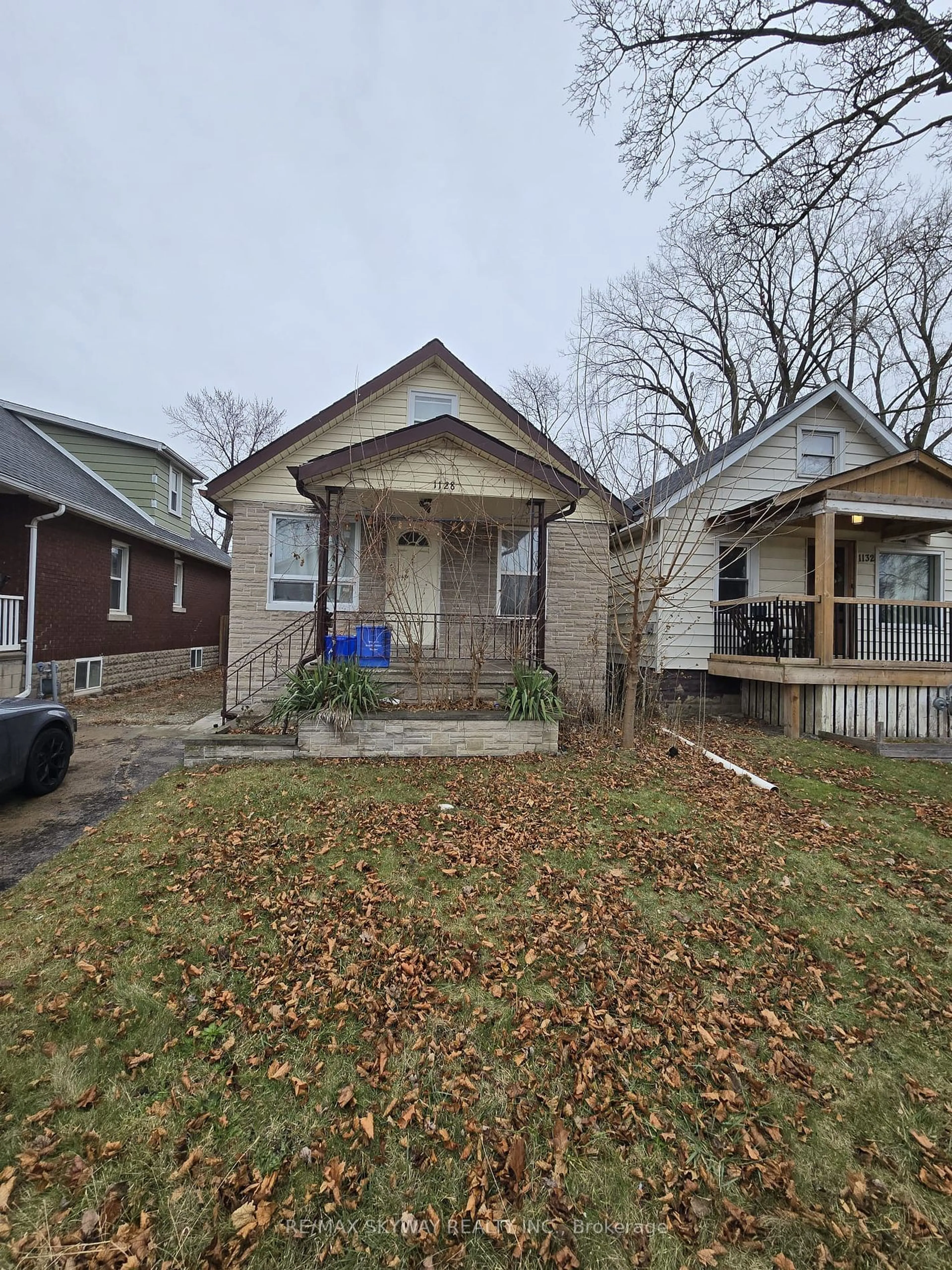 Home with brick exterior material, street for 1128 Curry Ave, Windsor Ontario N9B 2C9