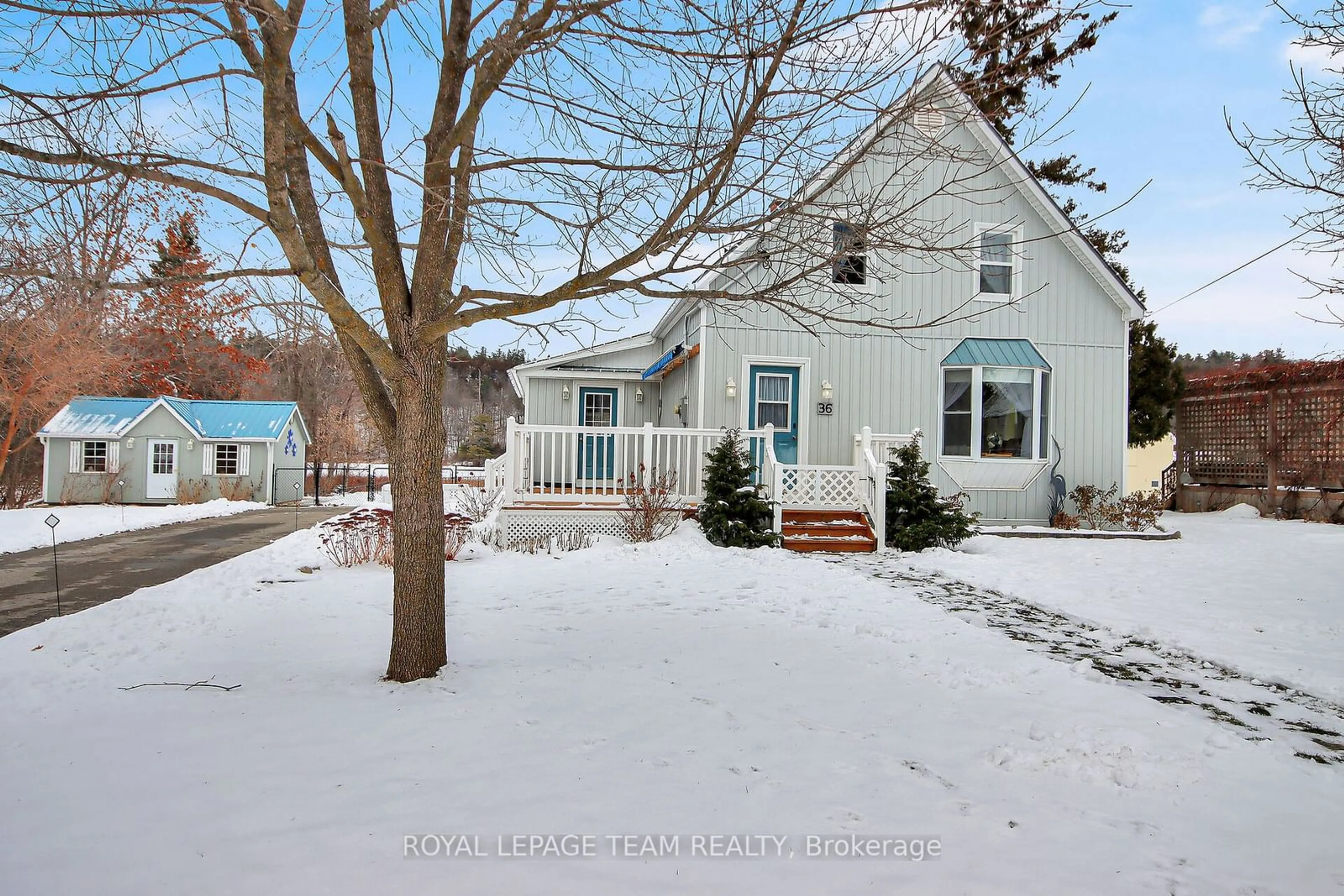 A pic from outside/outdoor area/front of a property/back of a property/a pic from drone, water/lake/river/ocean view for 36 Bedford St, Westport Ontario K0G 1X0