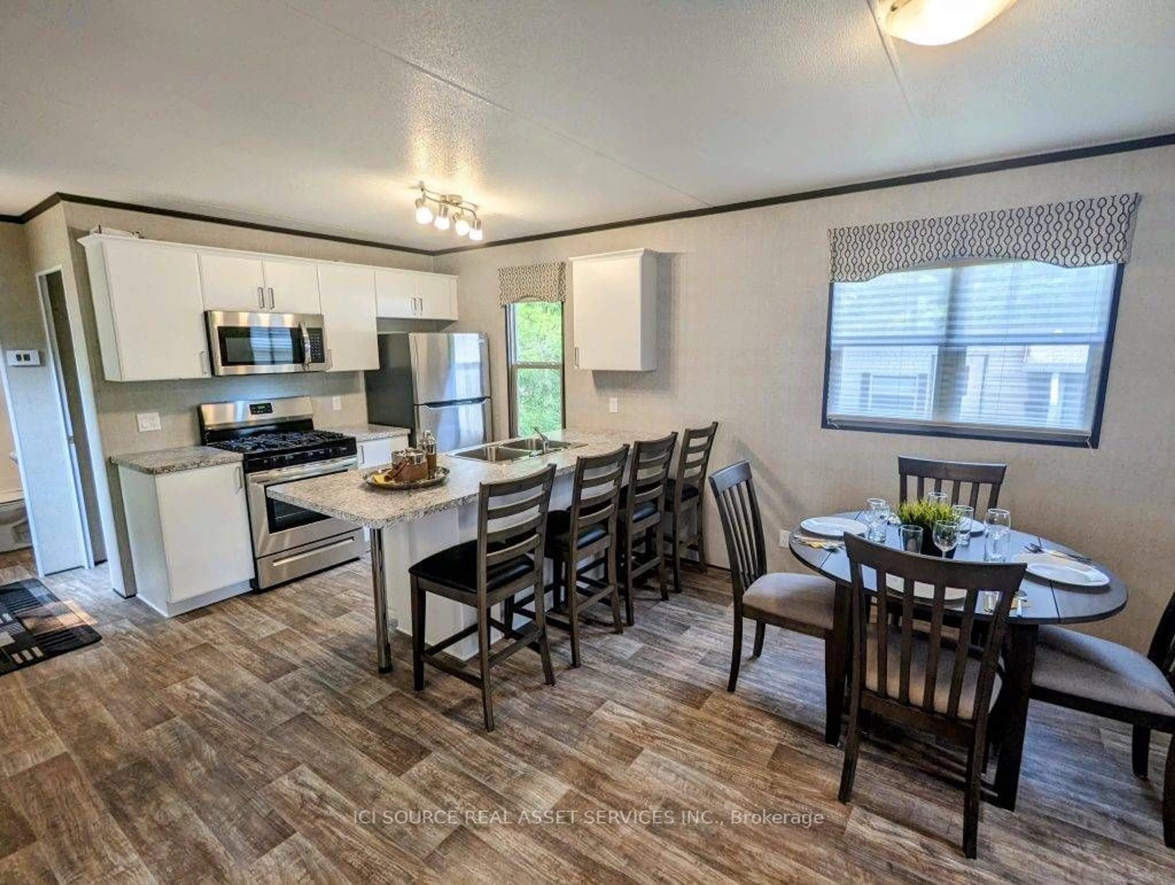 Open concept kitchen, wood/laminate floor for 155 McCrearys Beach #WHW636, Drummond/North Elmsley Ontario K7H 3C8