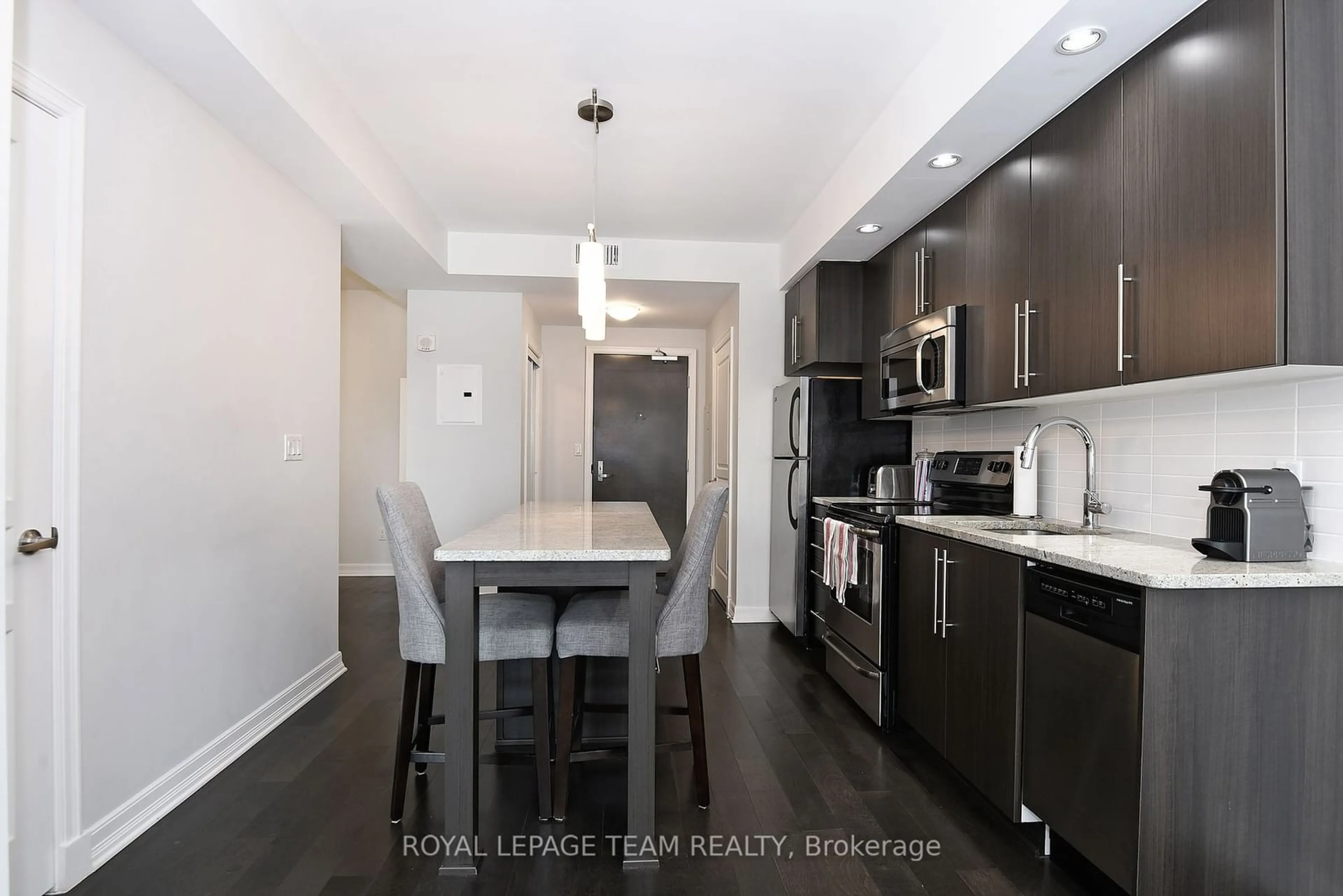 Open concept kitchen, wood/laminate floor for 238 Besserer St #711, Lower Town - Sandy Hill Ontario K1N 6B1