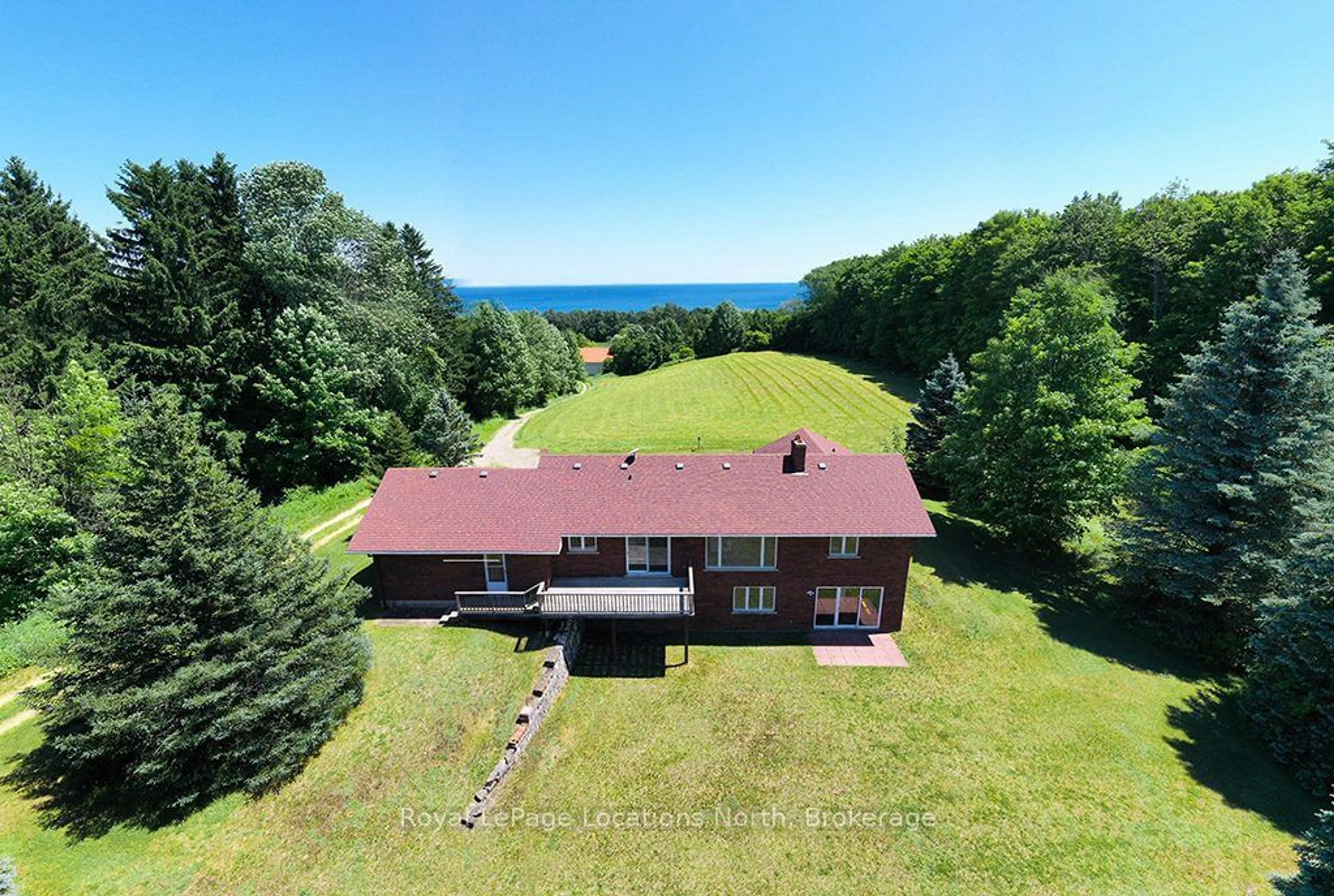 A pic from outside/outdoor area/front of a property/back of a property/a pic from drone, water/lake/river/ocean view for 159038 7th Line, Meaford Ontario N4L 1W5