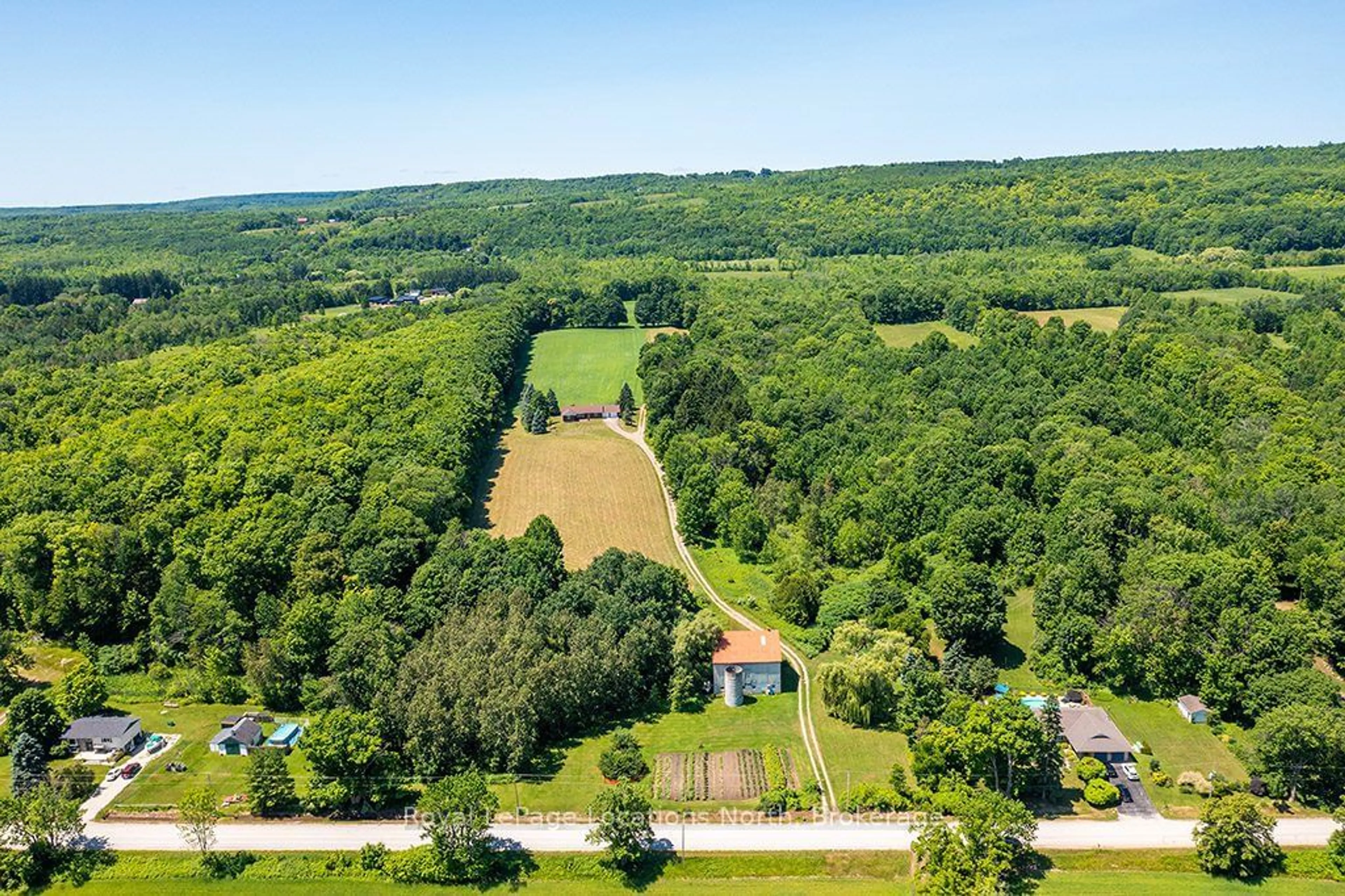 A pic from outside/outdoor area/front of a property/back of a property/a pic from drone, forest/trees view for 159038 7th Line, Meaford Ontario N4L 1W5