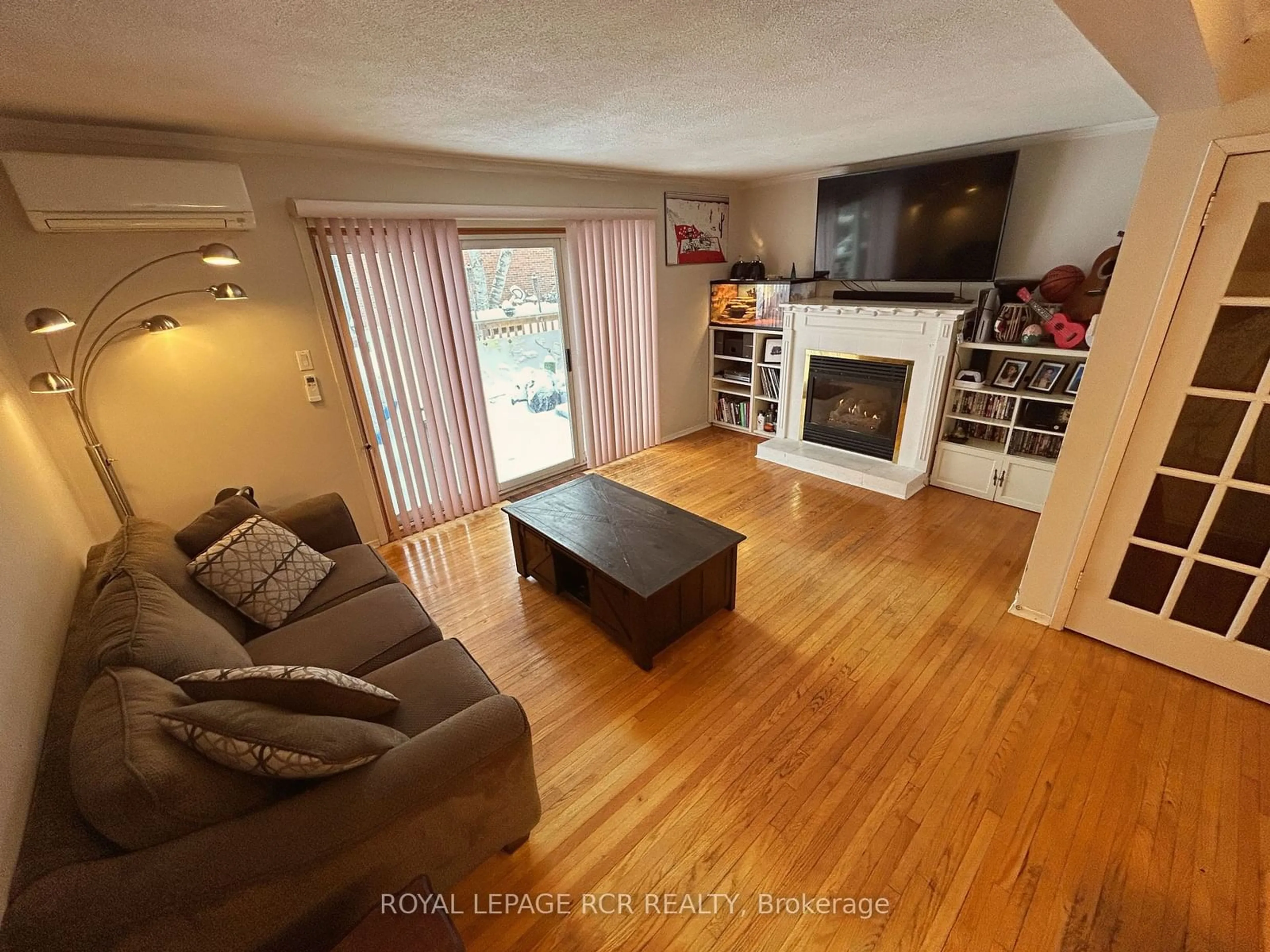 Living room with furniture, wood/laminate floor for 201 Silvercreek Pkwy #57, Guelph Ontario N1H 3T4