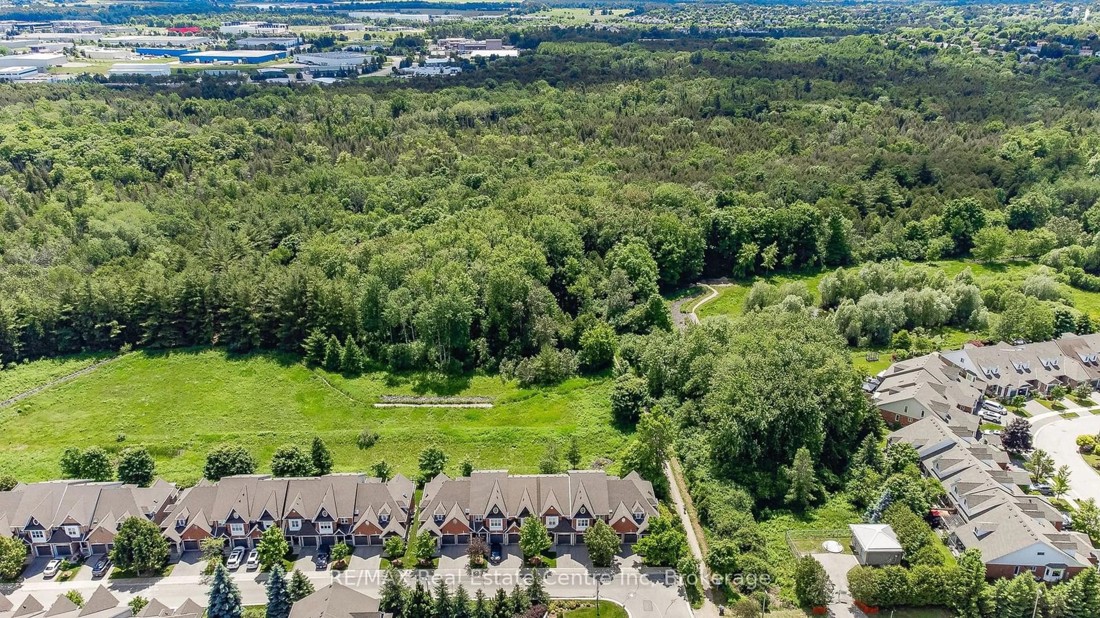 A pic from outside/outdoor area/front of a property/back of a property/a pic from drone, forest/trees view for 165 Terraview Cres #67, Guelph Ontario N1G 5G7