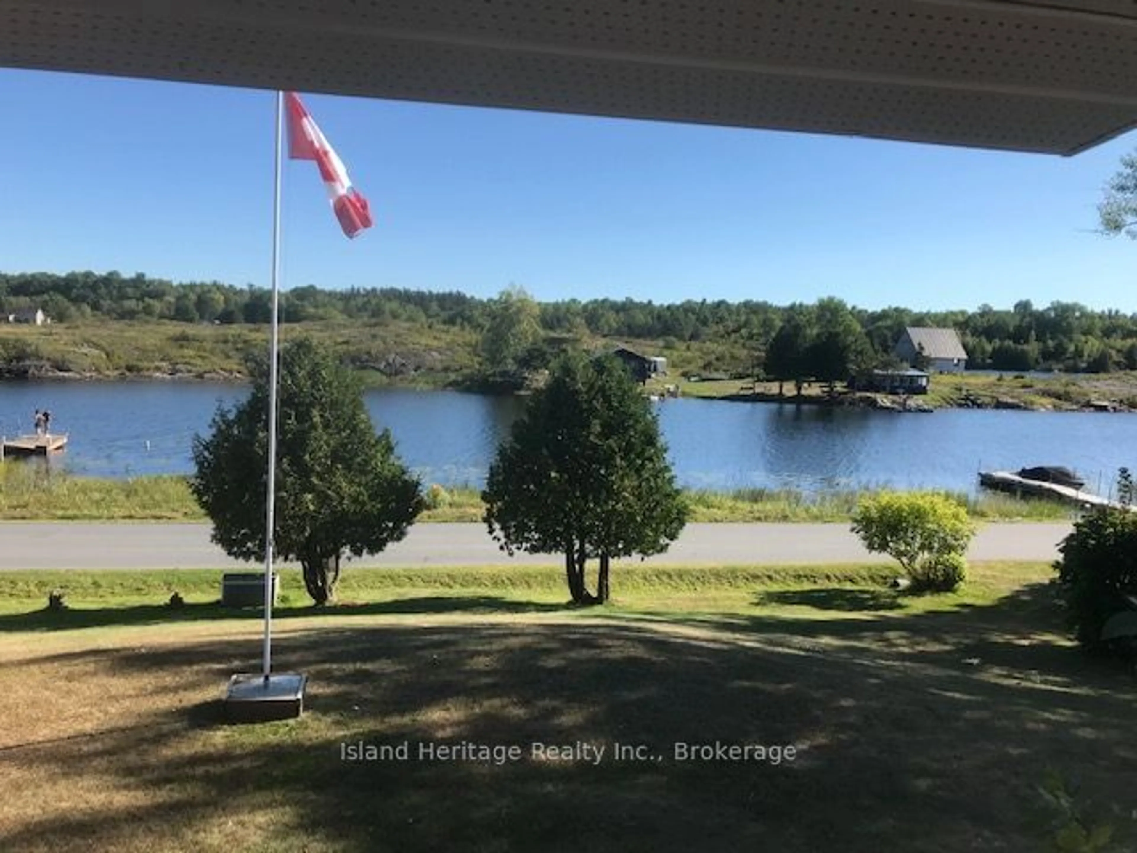 A pic from outside/outdoor area/front of a property/back of a property/a pic from drone, water/lake/river/ocean view for 1465 RIVERSIDE Dr, Parry Sound Ontario P0B 1G0