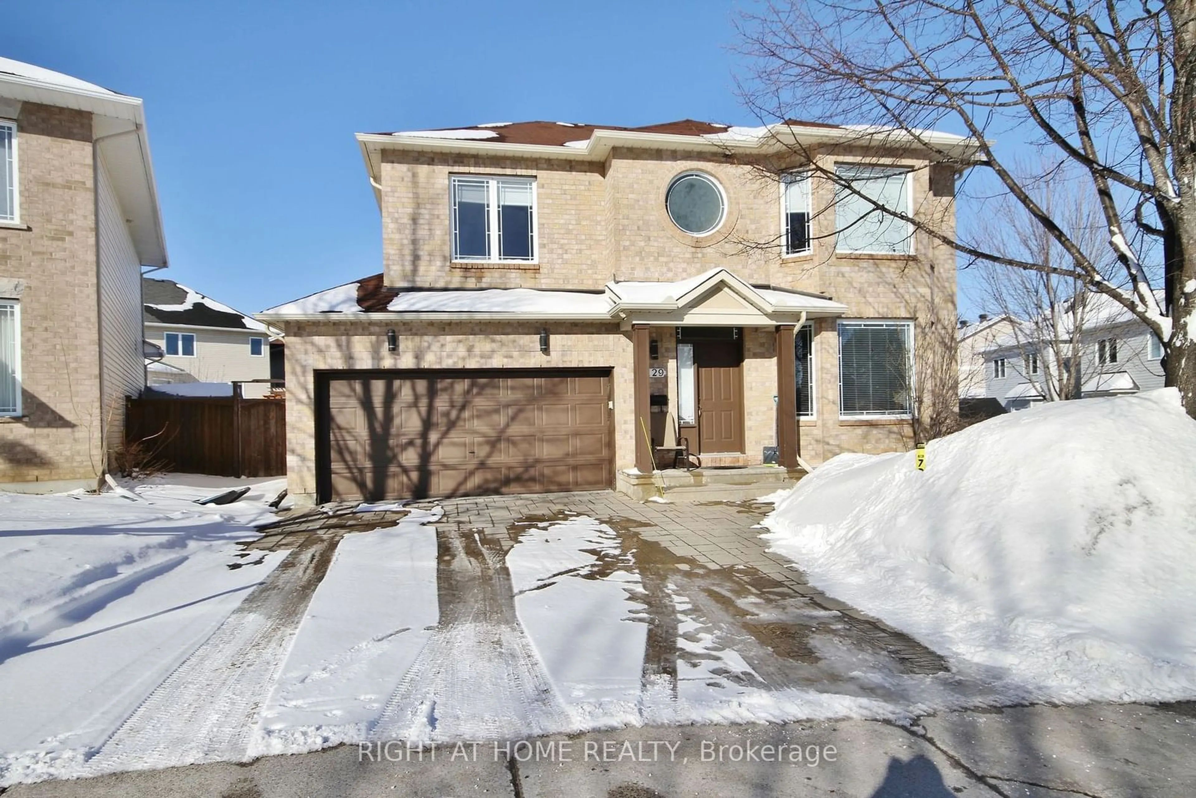 Home with brick exterior material, street for 129 ROCKY HILL Dr, Barrhaven Ontario K2G 7B2