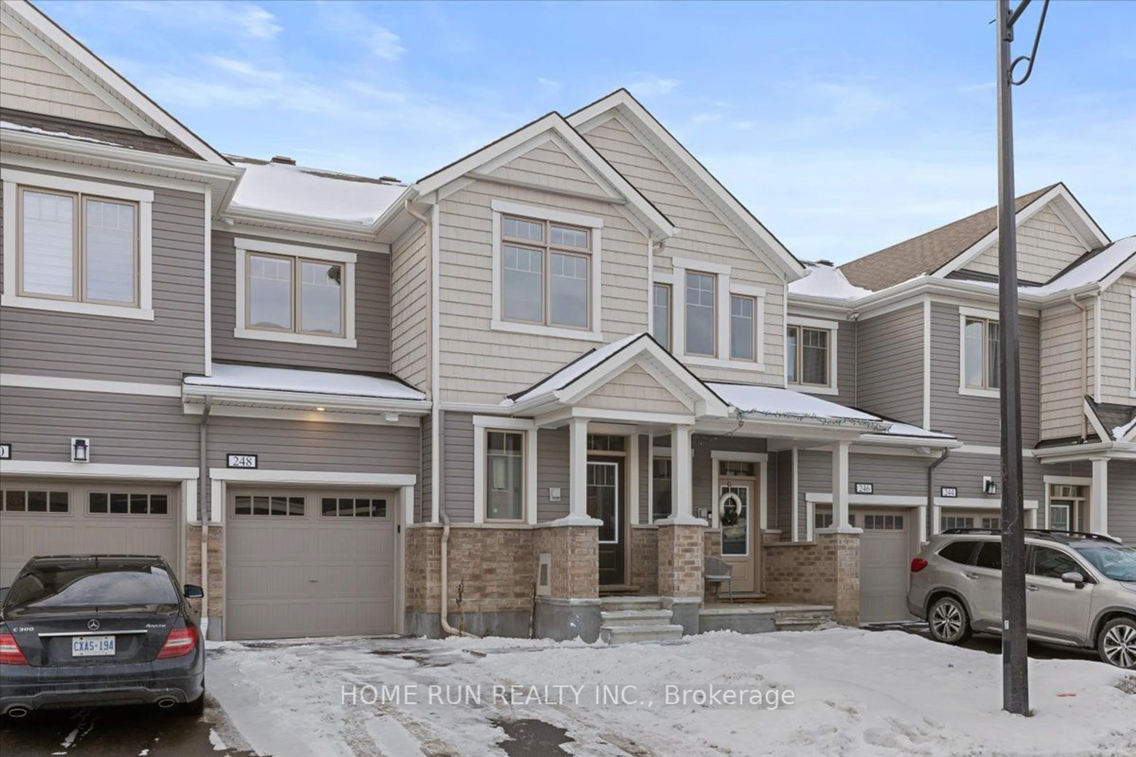 Home with brick exterior material, street for 248 ATIMA Circ, Barrhaven Ontario K2J 6T5