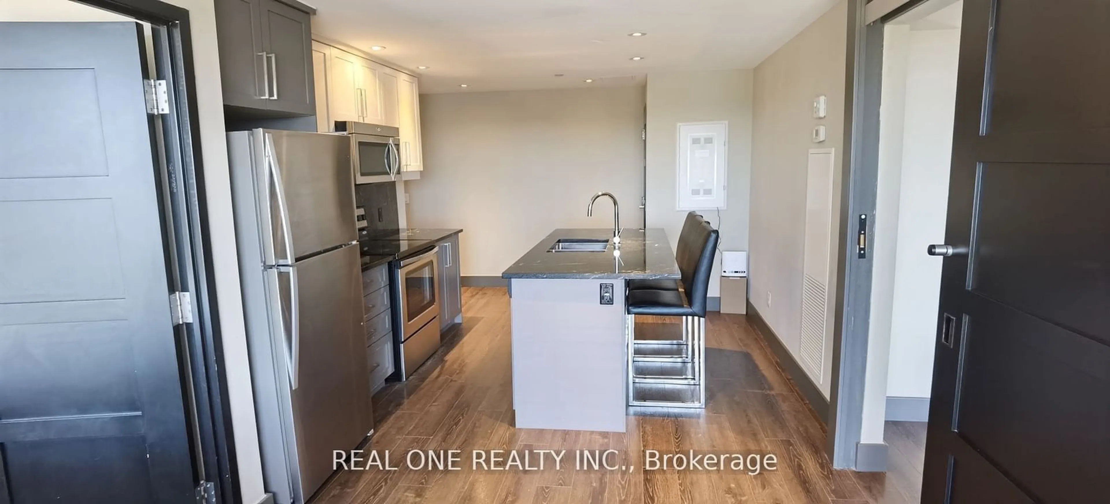 Open concept kitchen, wood/laminate floor for 330 Phillip St #S1402, Waterloo Ontario N2L 3W9