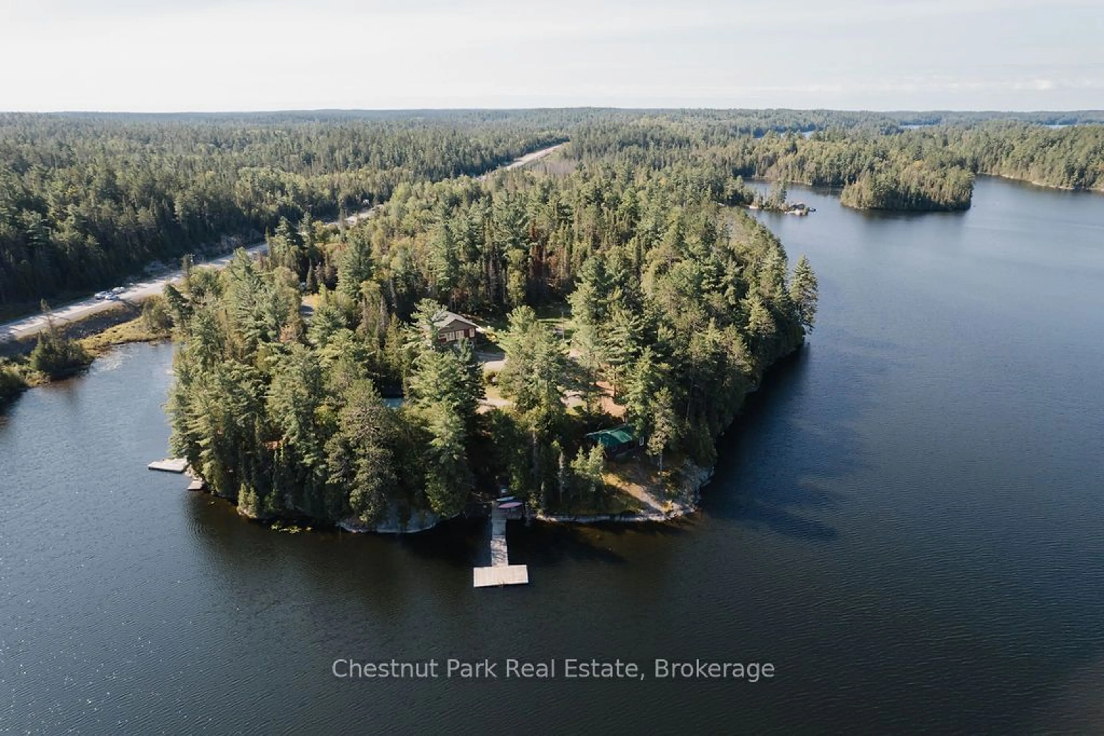 A pic from outside/outdoor area/front of a property/back of a property/a pic from drone, water/lake/river/ocean view for 4574 Highway 11, Temagami Ontario P0H 2H0