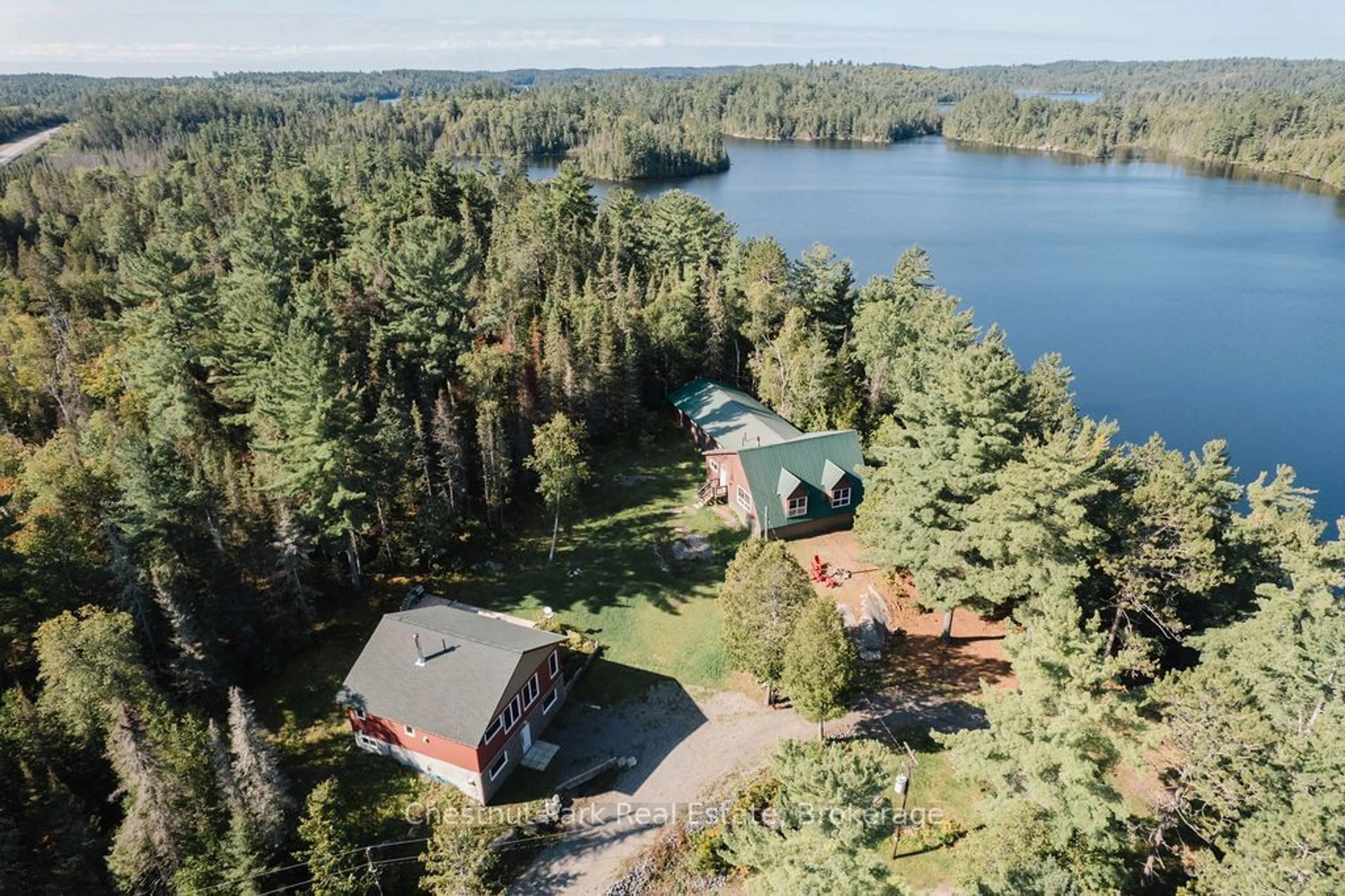 A pic from outside/outdoor area/front of a property/back of a property/a pic from drone, water/lake/river/ocean view for 4574 Highway 11, Temagami Ontario P0H 2H0