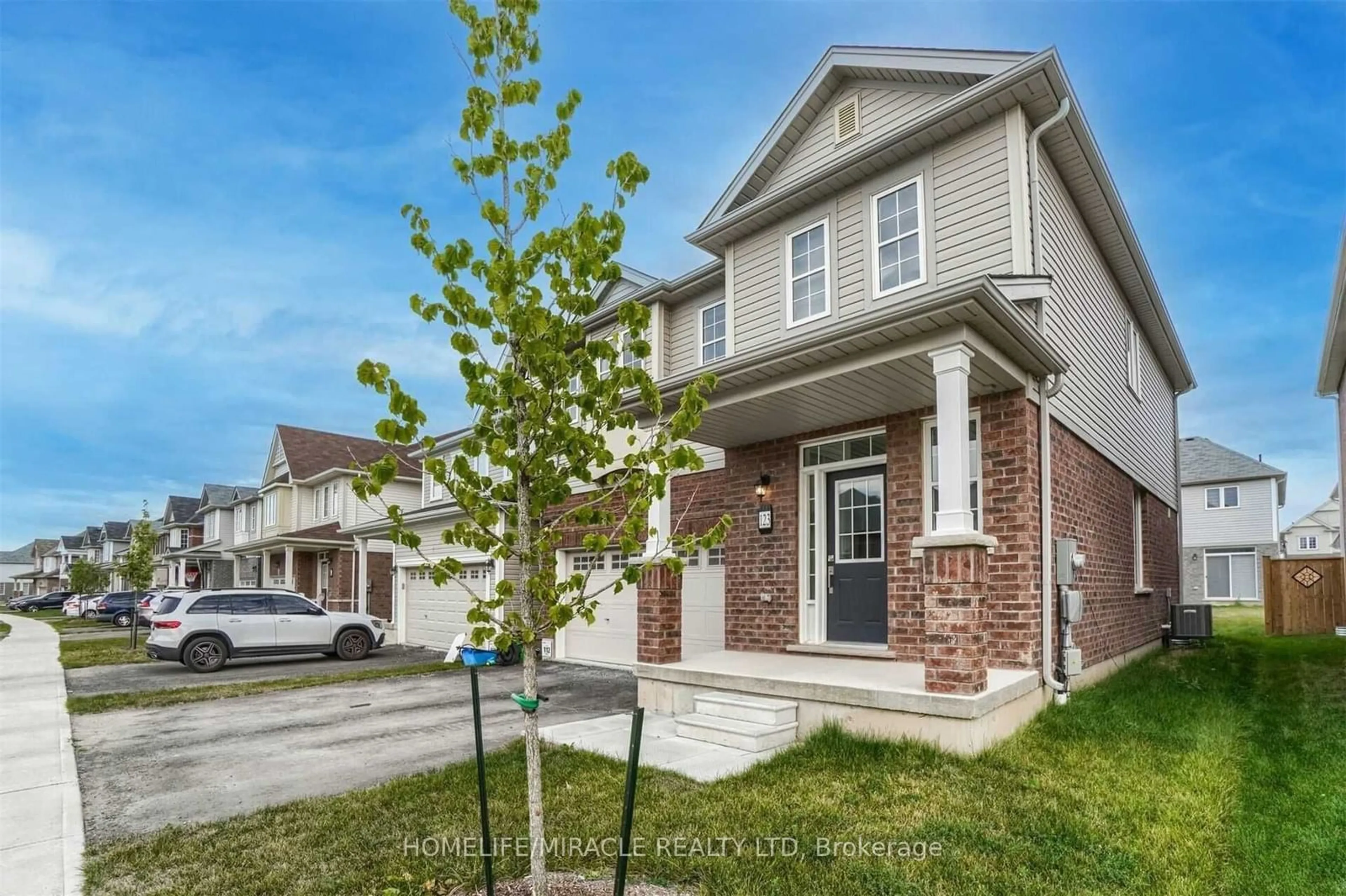 Home with brick exterior material, street for 123 Longboat Run, Brantford Ontario N3T 0R8