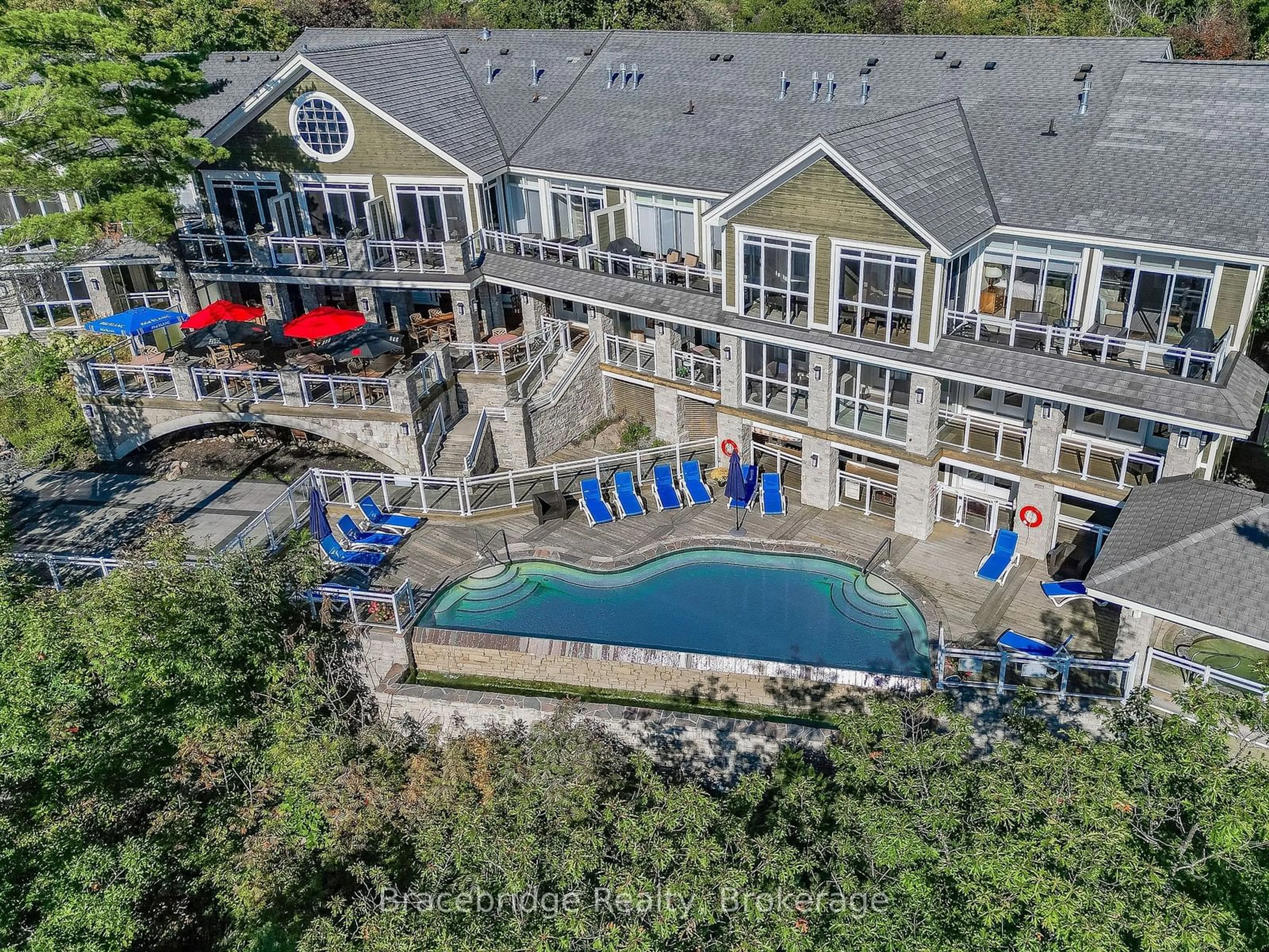 A pic from outside/outdoor area/front of a property/back of a property/a pic from drone, water/lake/river/ocean view for 1869 Muskoka Rd 118 #L201-D2, Muskoka Lakes Ontario P1L 1W8