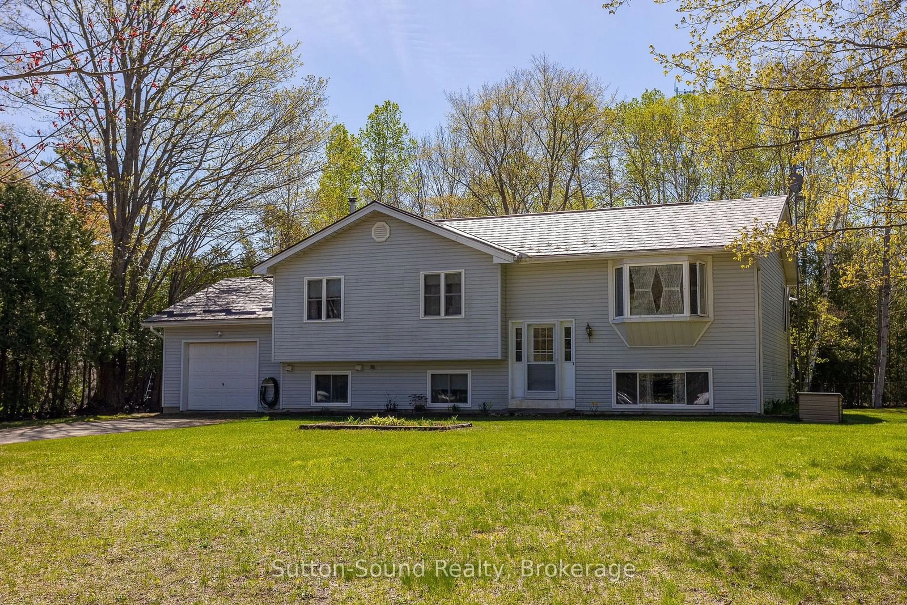 Home with vinyl exterior material, street for 22 AVELE Rd, South Bruce Peninsula Ontario N0H 2T0