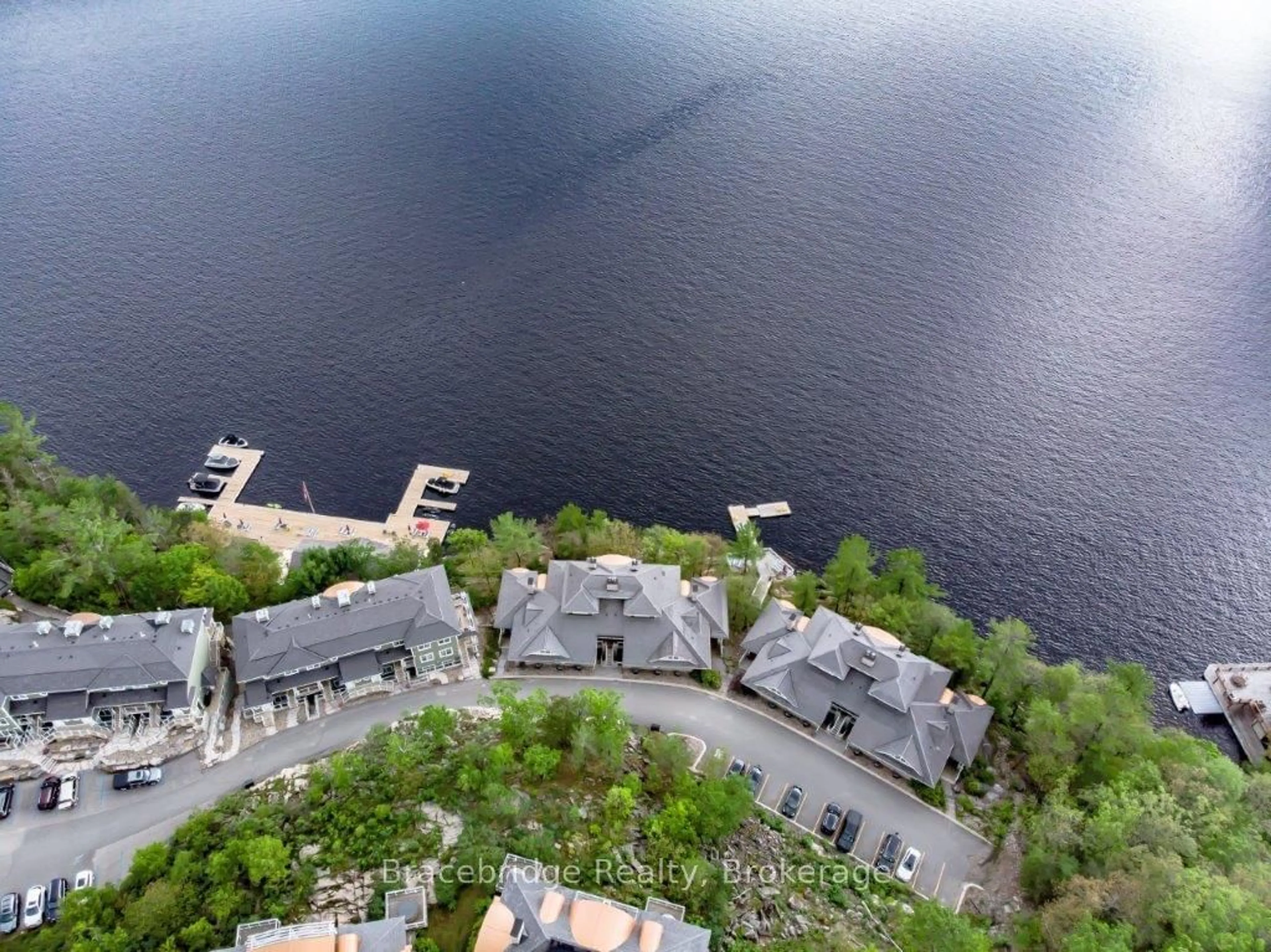 A pic from outside/outdoor area/front of a property/back of a property/a pic from drone, water/lake/river/ocean view for 1869 Muskoka 118 Rd #A102, Muskoka Lakes Ontario P1L 1W8