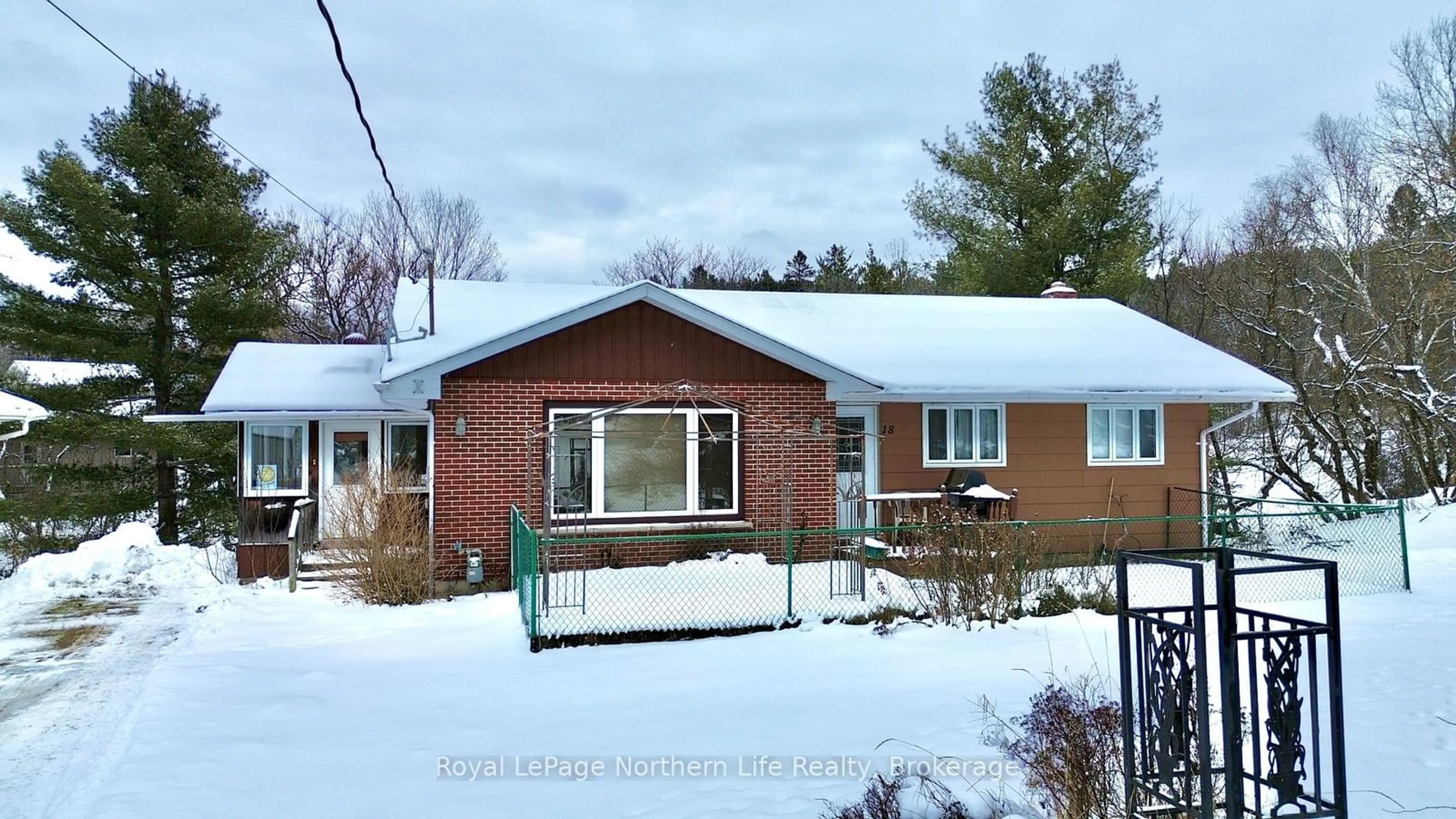 Home with vinyl exterior material, street for 18 Big Bend Ave, Powassan Ontario P0H 1Z0