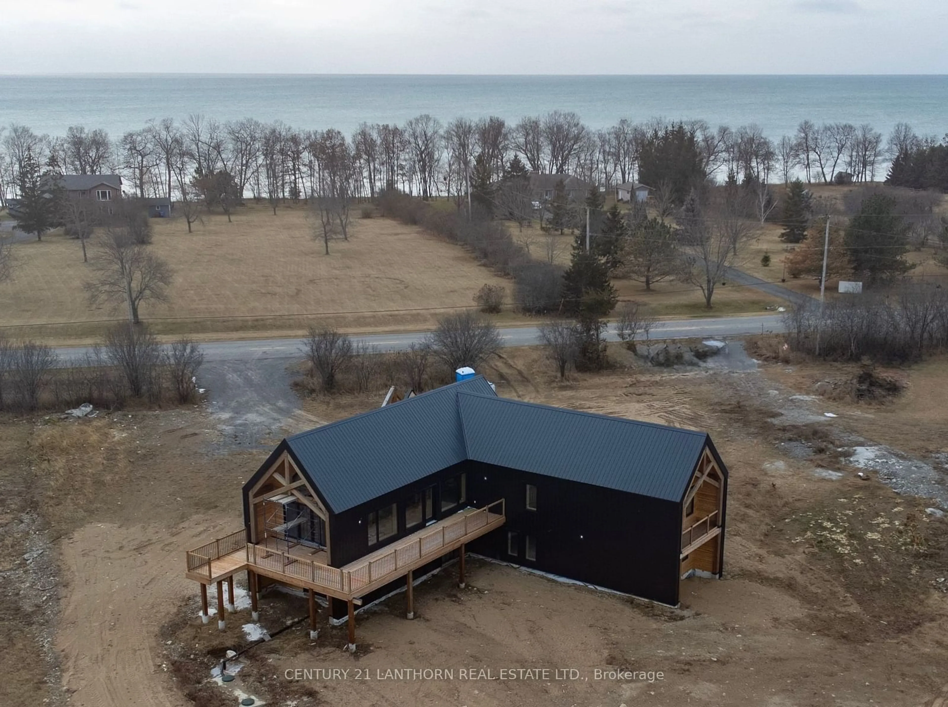 A pic from outside/outdoor area/front of a property/back of a property/a pic from drone, water/lake/river/ocean view for 1150 County Road 20 Rd, Prince Edward County Ontario K0K 2L0