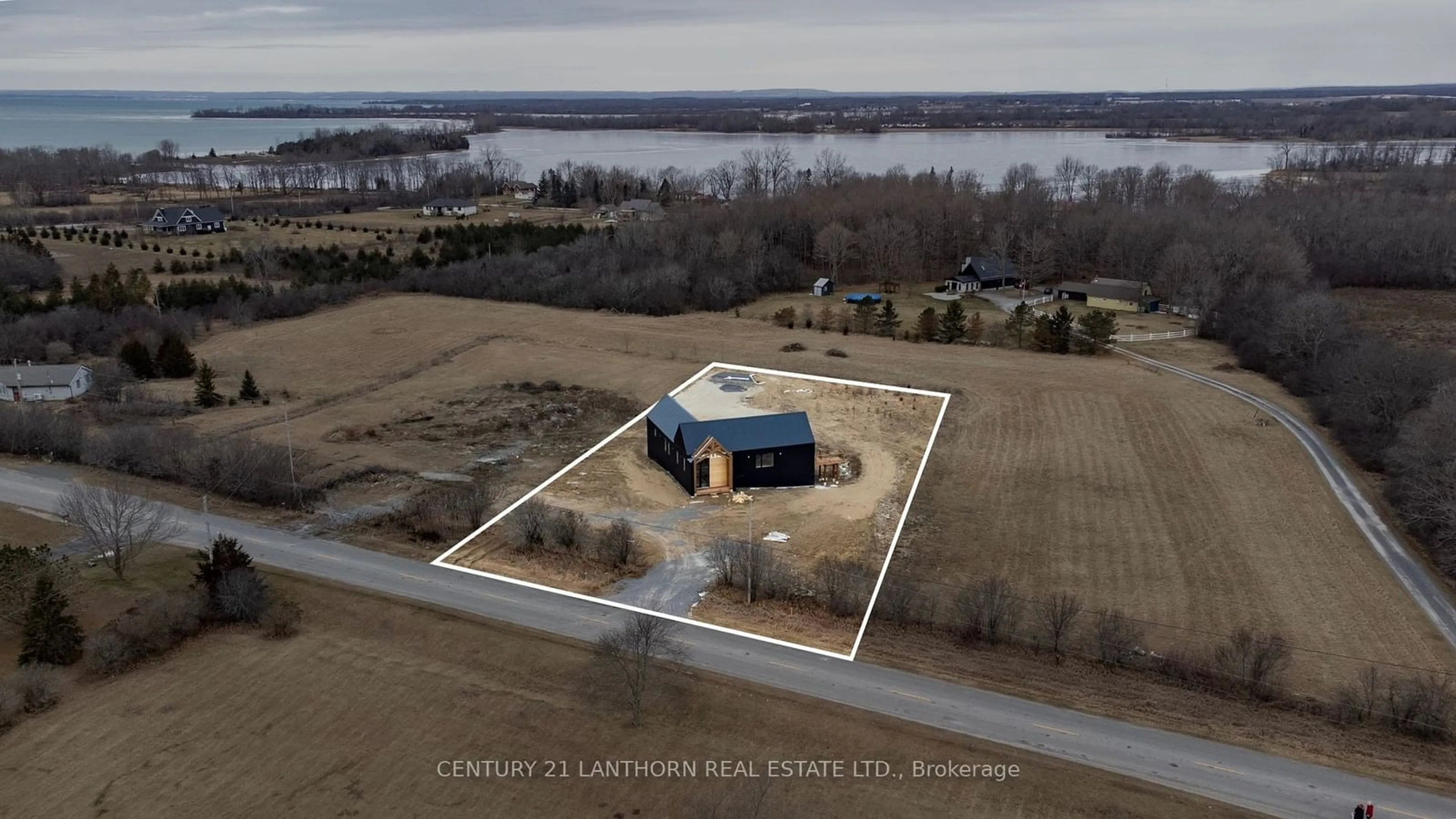 A pic from outside/outdoor area/front of a property/back of a property/a pic from drone, water/lake/river/ocean view for 1150 County Road 20 Rd, Prince Edward County Ontario K0K 2L0