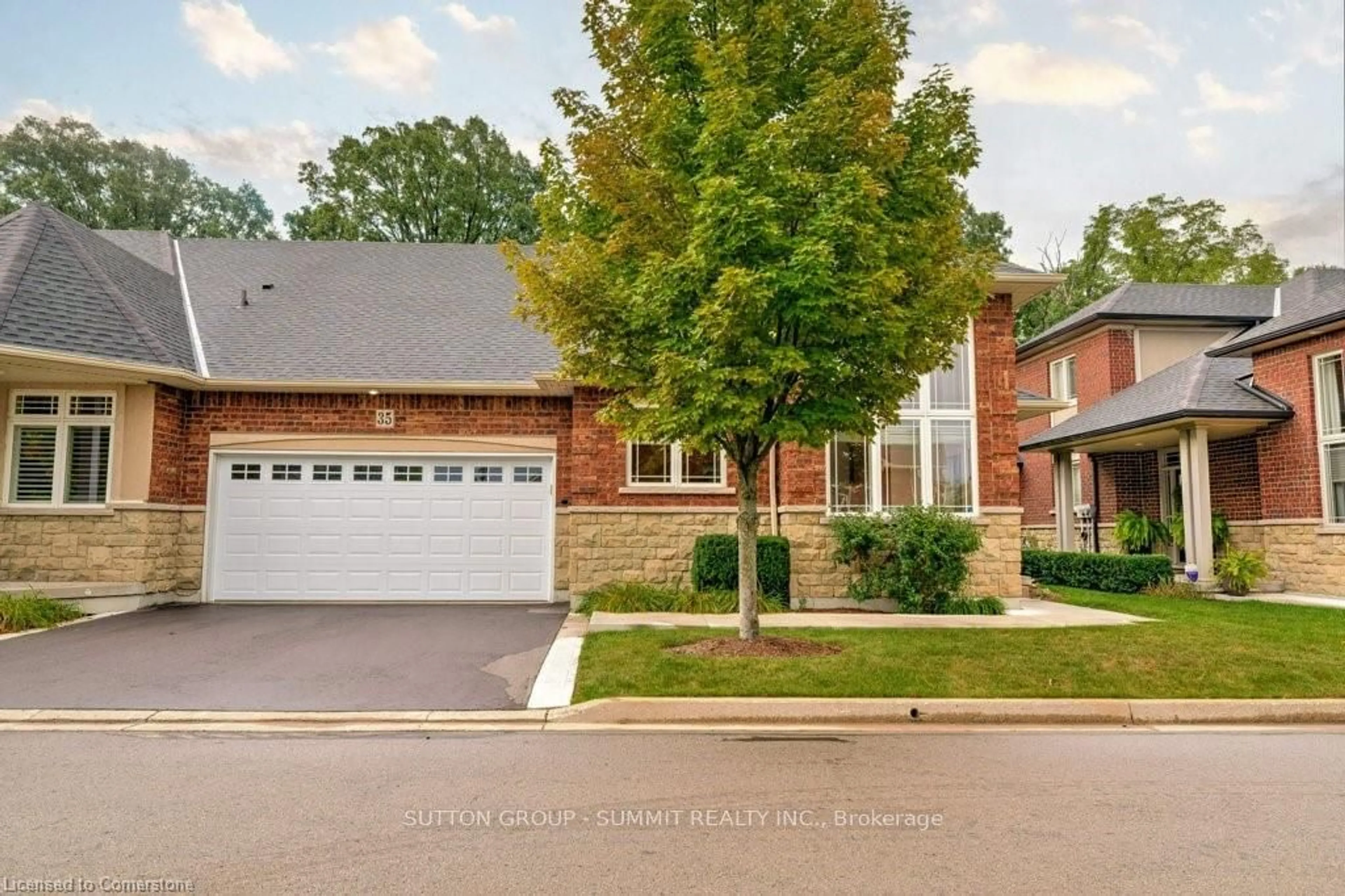 Home with brick exterior material, street for 35 Landscapes Tr, Hamilton Ontario L9K 0A1