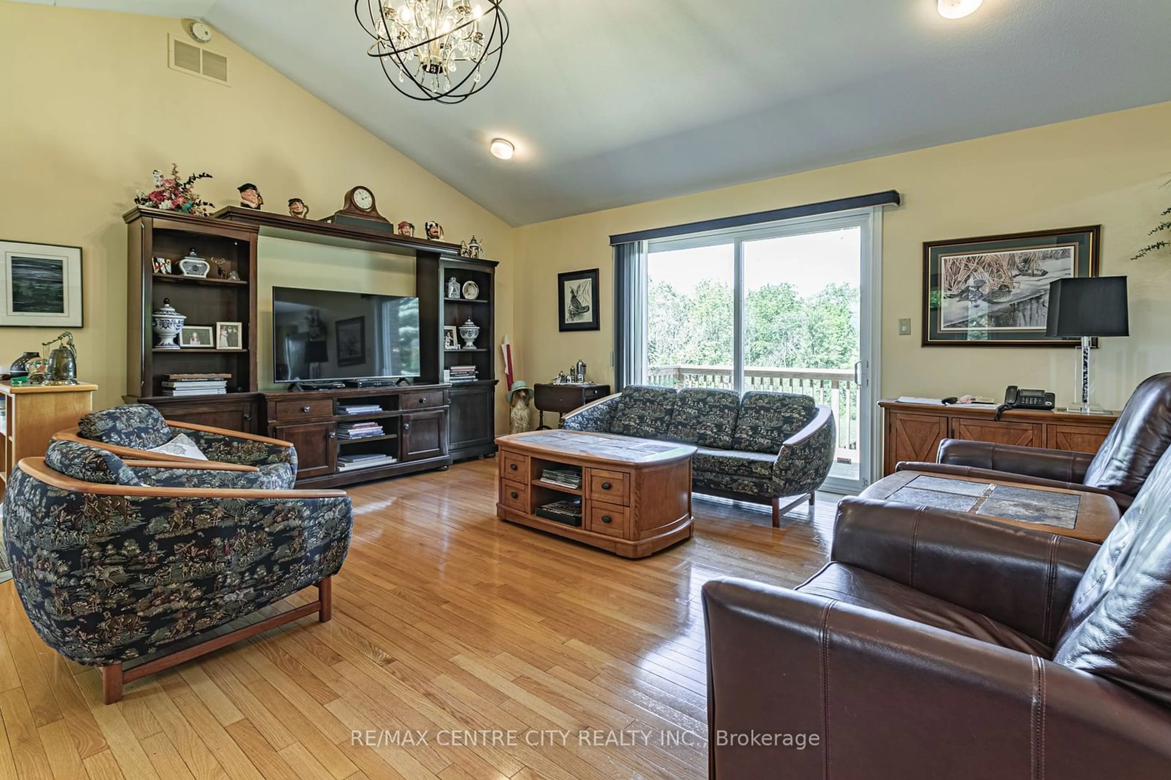 Living room with furniture, wood/laminate floor for 15260 Furnival Rd, West Elgin Ontario N0P 2C0