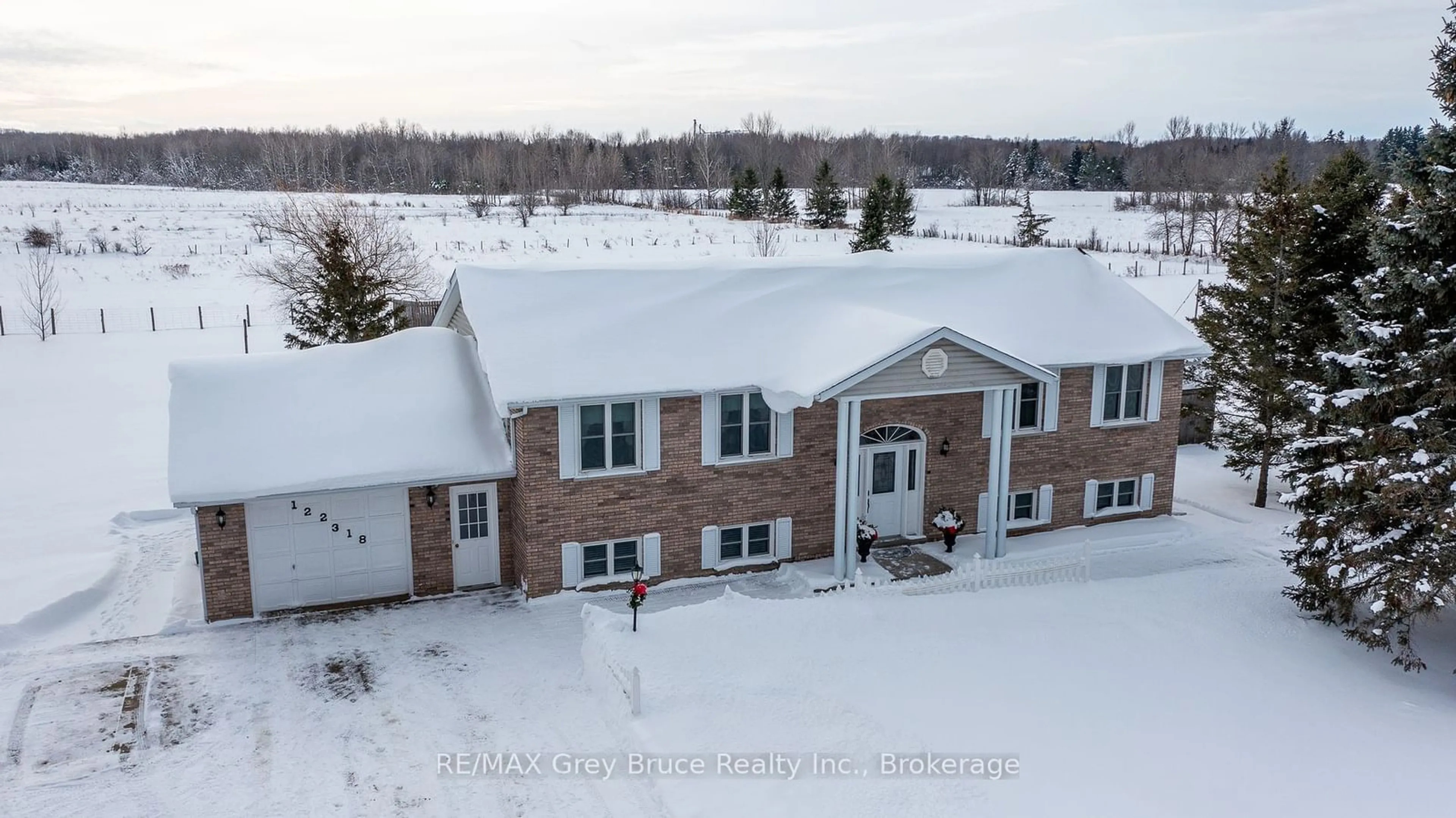 A pic from outside/outdoor area/front of a property/back of a property/a pic from drone, building for 122318 Grey Road 5 Rd, Georgian Bluffs Ontario N4K 5N5