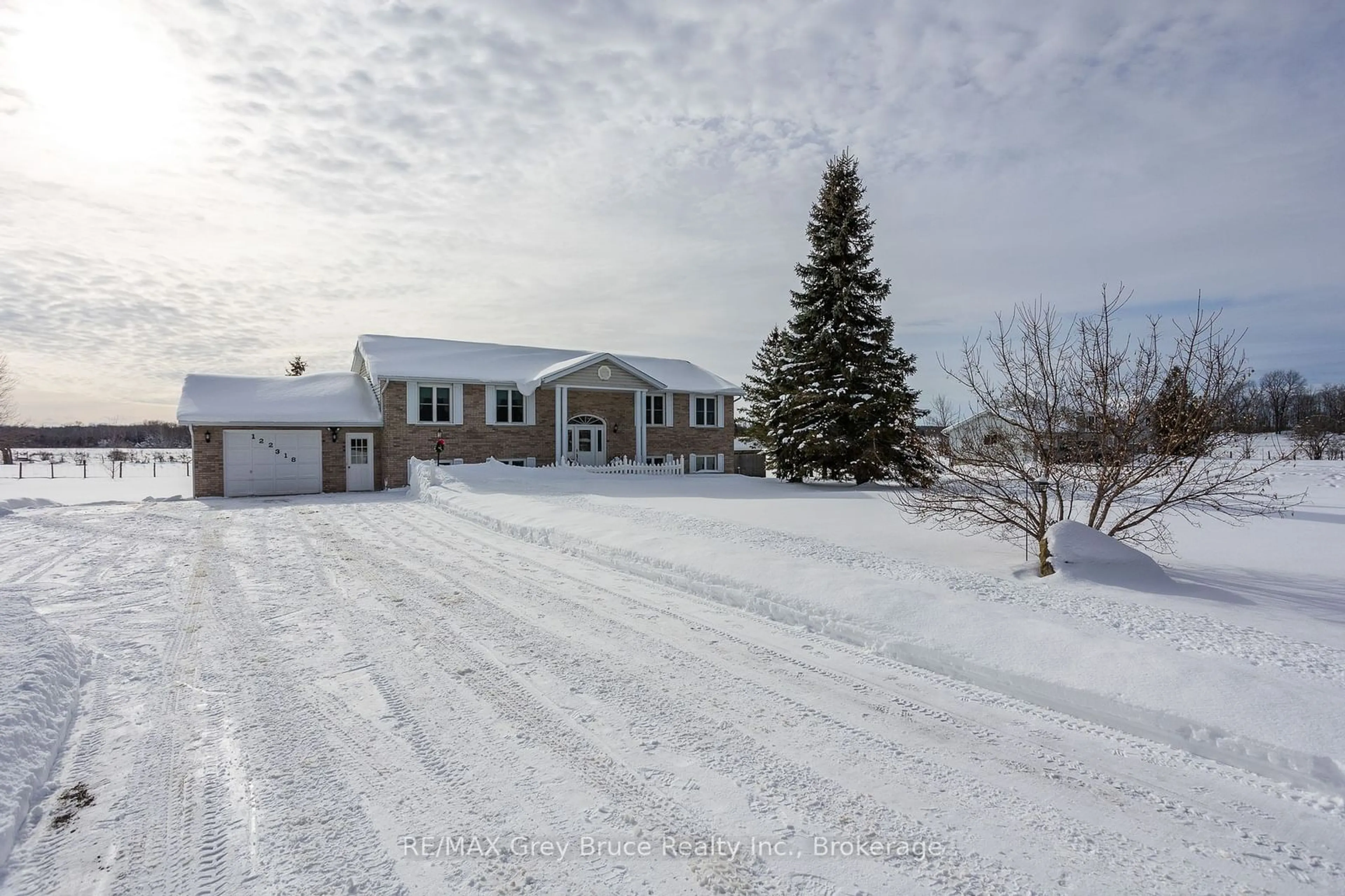 A pic from outside/outdoor area/front of a property/back of a property/a pic from drone, street for 122318 Grey Road 5 Rd, Georgian Bluffs Ontario N4K 5N5