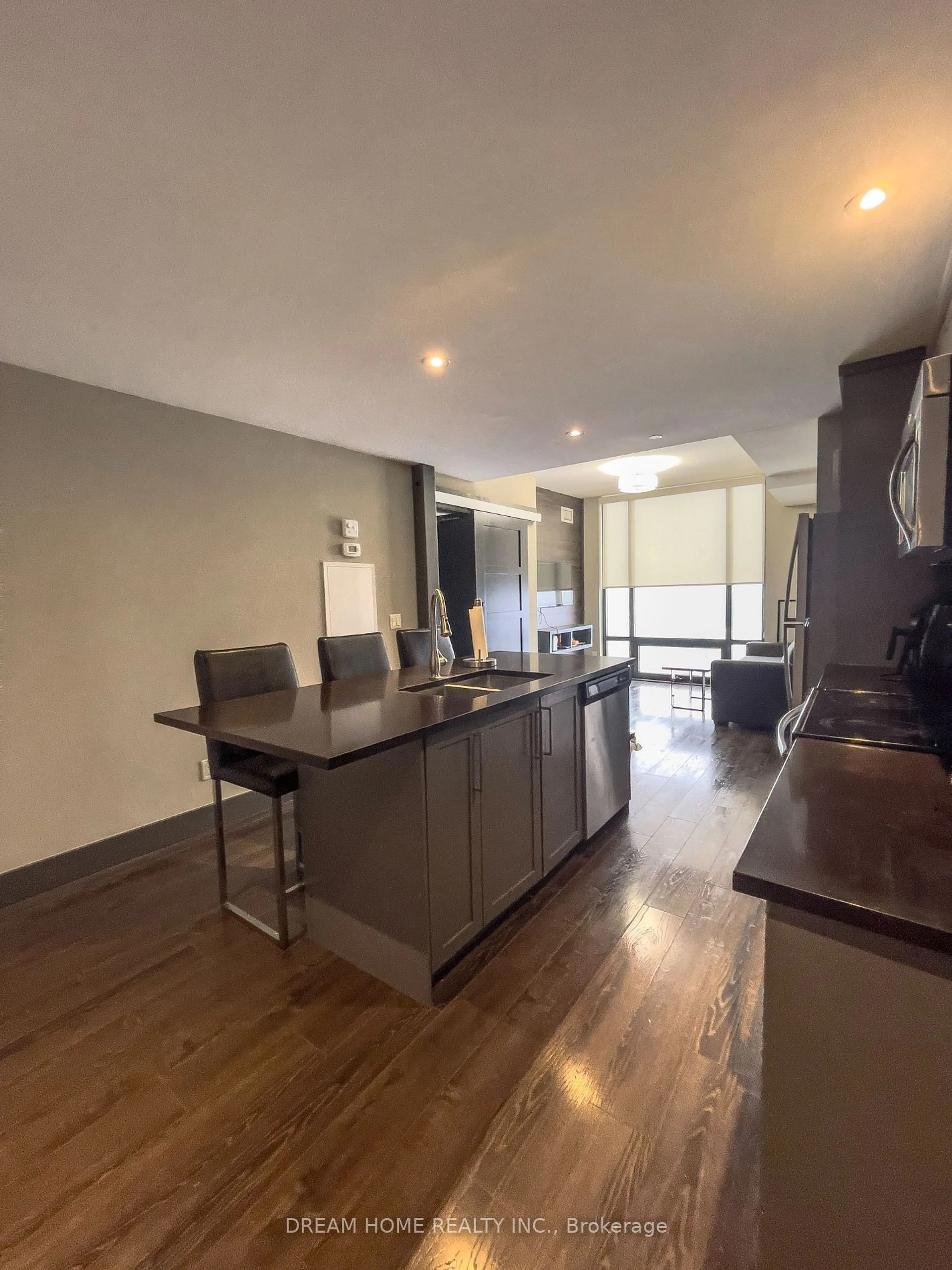 Open concept kitchen, wood/laminate floor for 330 Phillip St #N2601, Waterloo Ontario N2L 3W9