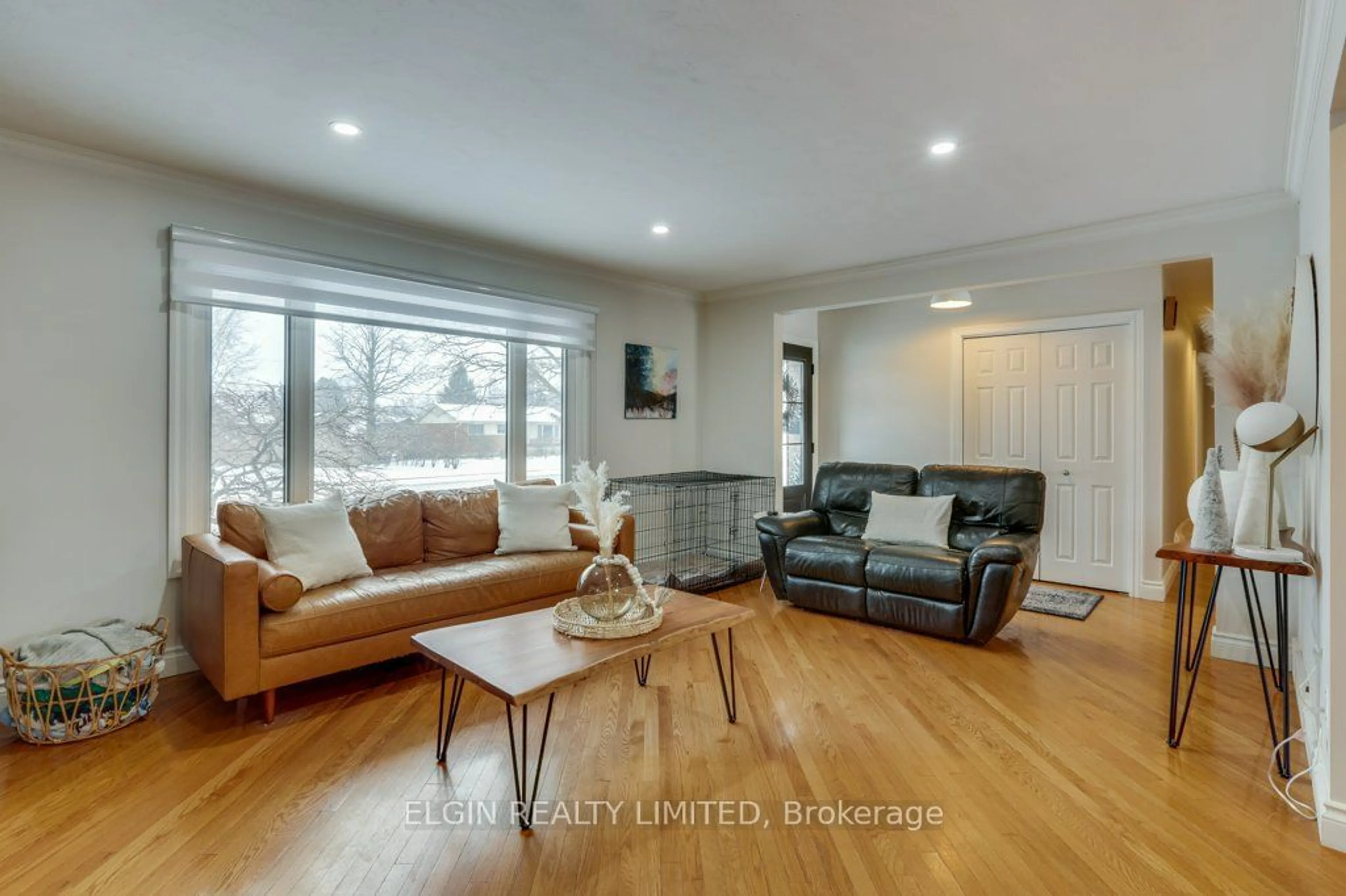 Living room with furniture, wood/laminate floor for 82 Lawton St, St. Thomas Ontario N5R 1X2