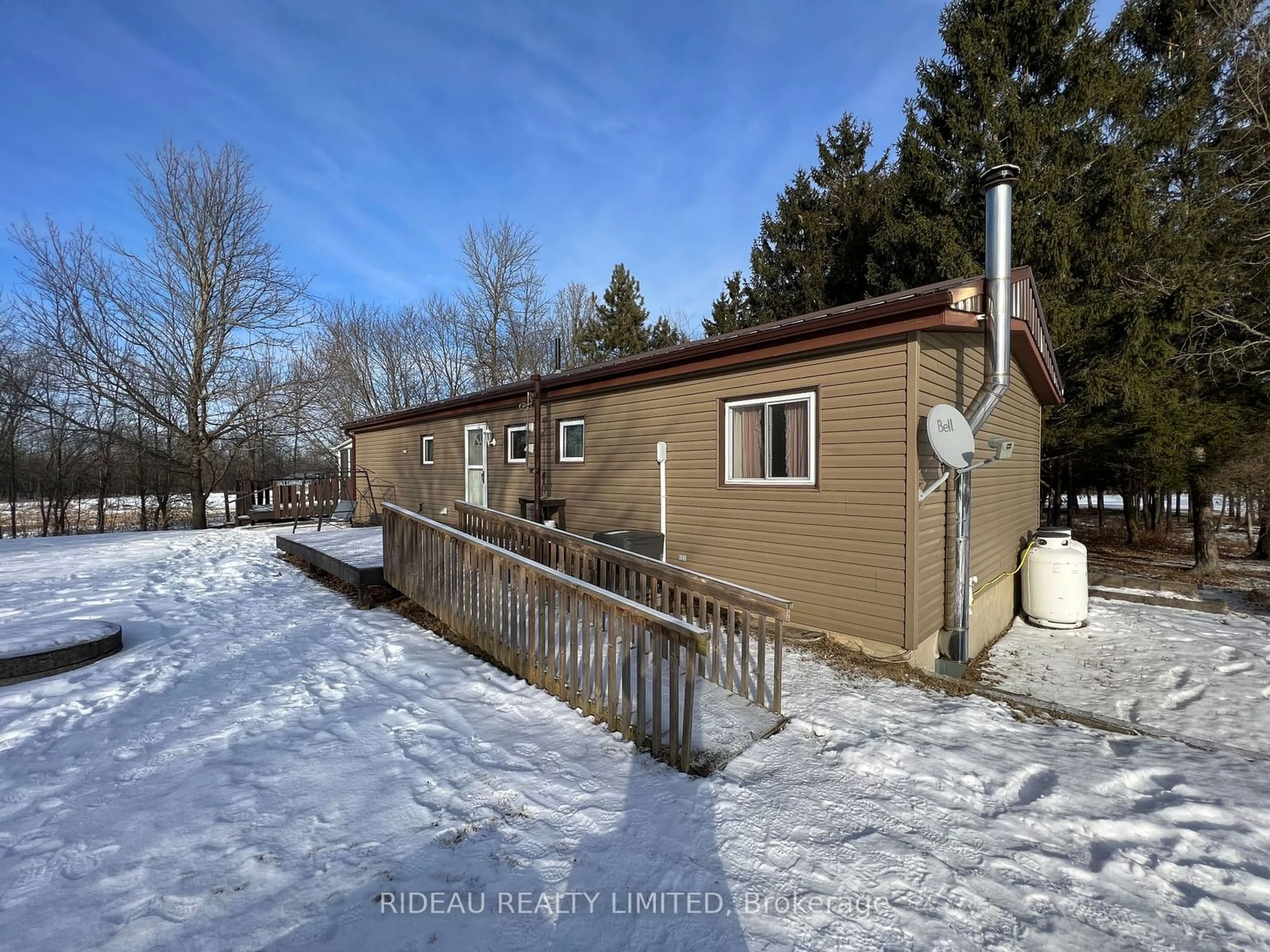 A pic from outside/outdoor area/front of a property/back of a property/a pic from drone, street for 3418 Highway 15, Rideau Lakes Ontario K0G 1E0