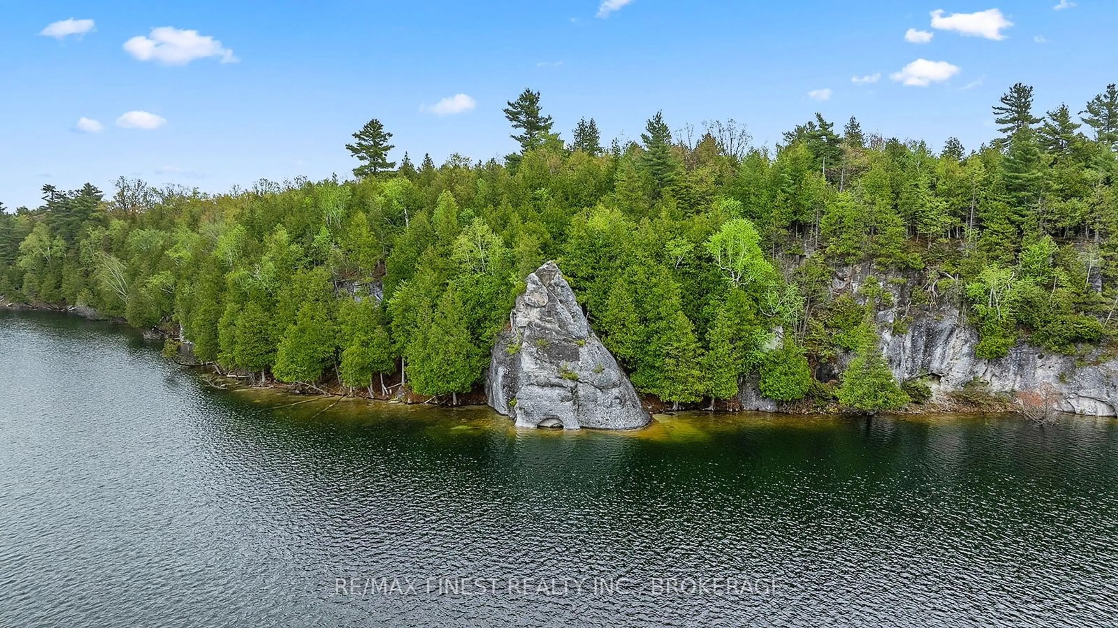 A pic from outside/outdoor area/front of a property/back of a property/a pic from drone, water/lake/river/ocean view for 8126 PERTH Rd, South Frontenac Ontario K0H 2L0