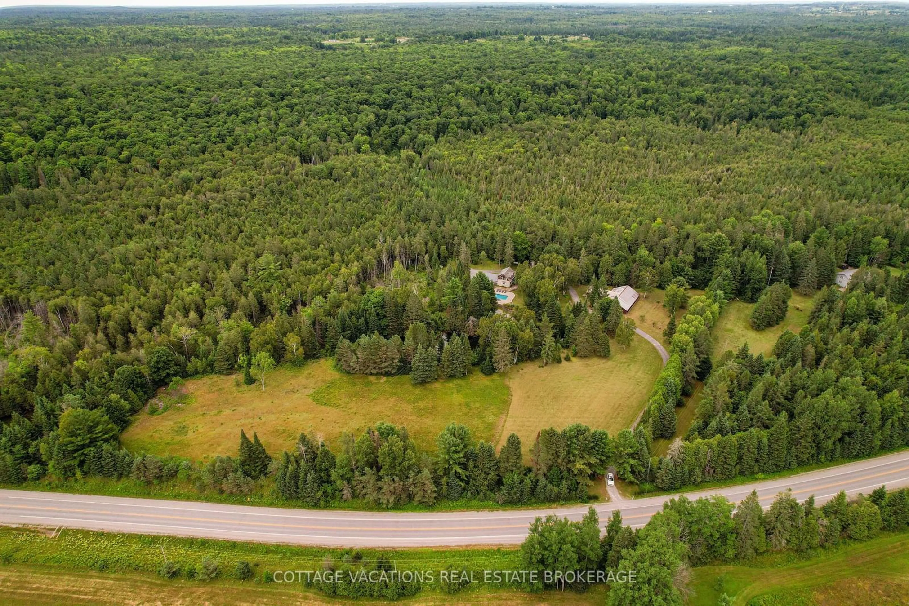 A pic from outside/outdoor area/front of a property/back of a property/a pic from drone, forest/trees view for 2090 County 121 Rd, Kawartha Lakes Ontario K0M 1C0