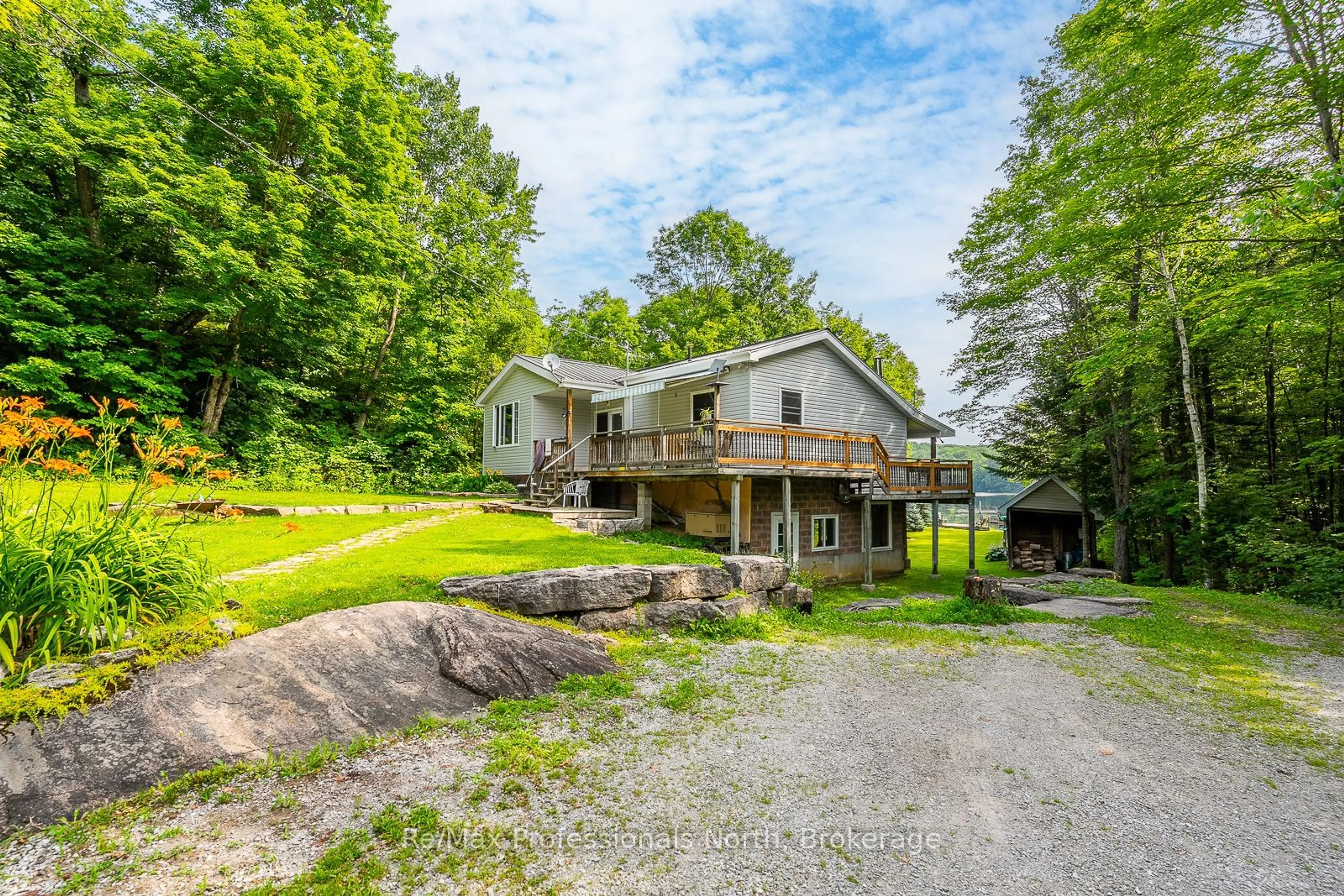 A pic from outside/outdoor area/front of a property/back of a property/a pic from drone, water/lake/river/ocean view for 1272 Little Bob Lake Rd, Minden Hills Ontario K0M 2K0