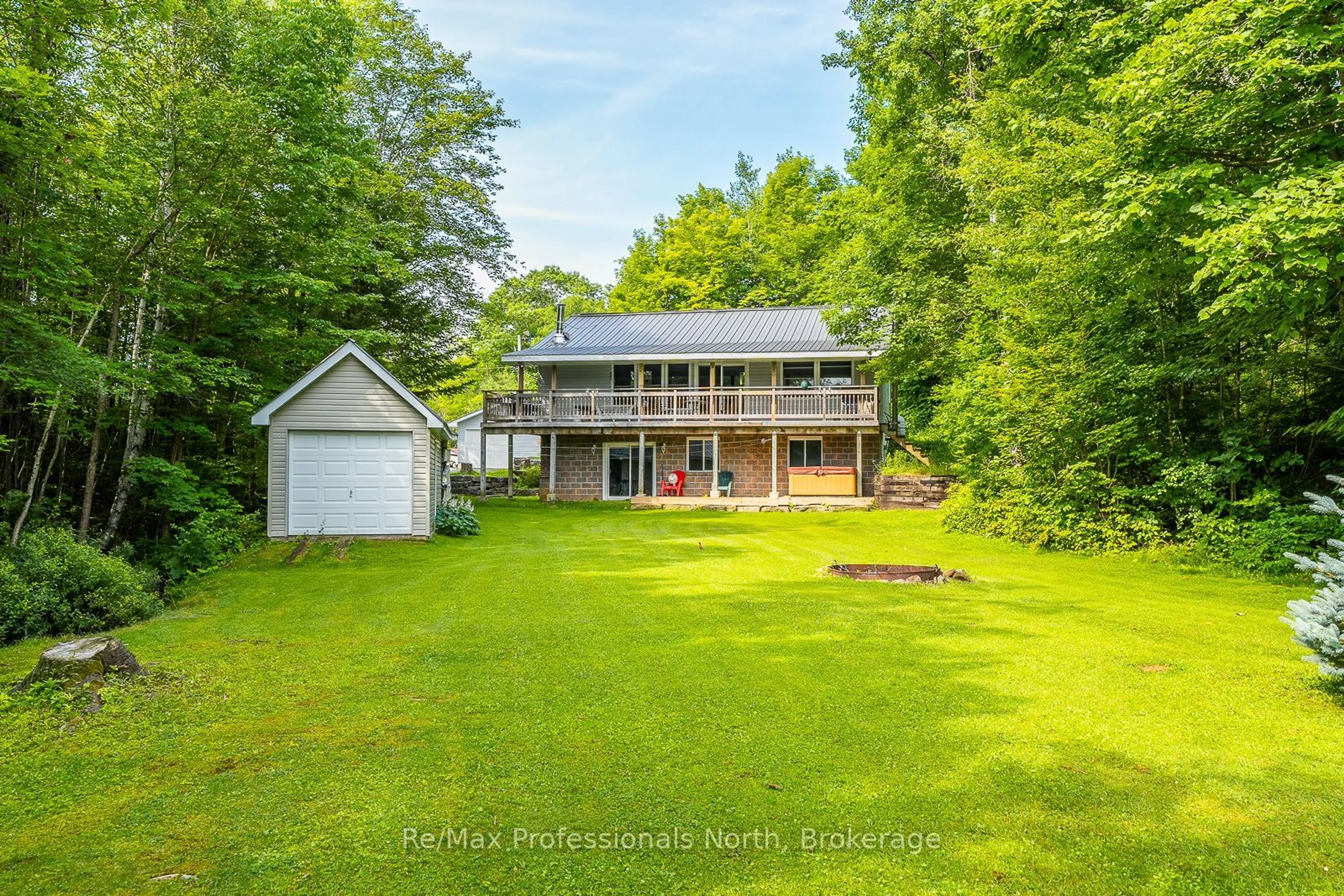 A pic from outside/outdoor area/front of a property/back of a property/a pic from drone, water/lake/river/ocean view for 1272 Little Bob Lake Rd, Minden Hills Ontario K0M 2K0