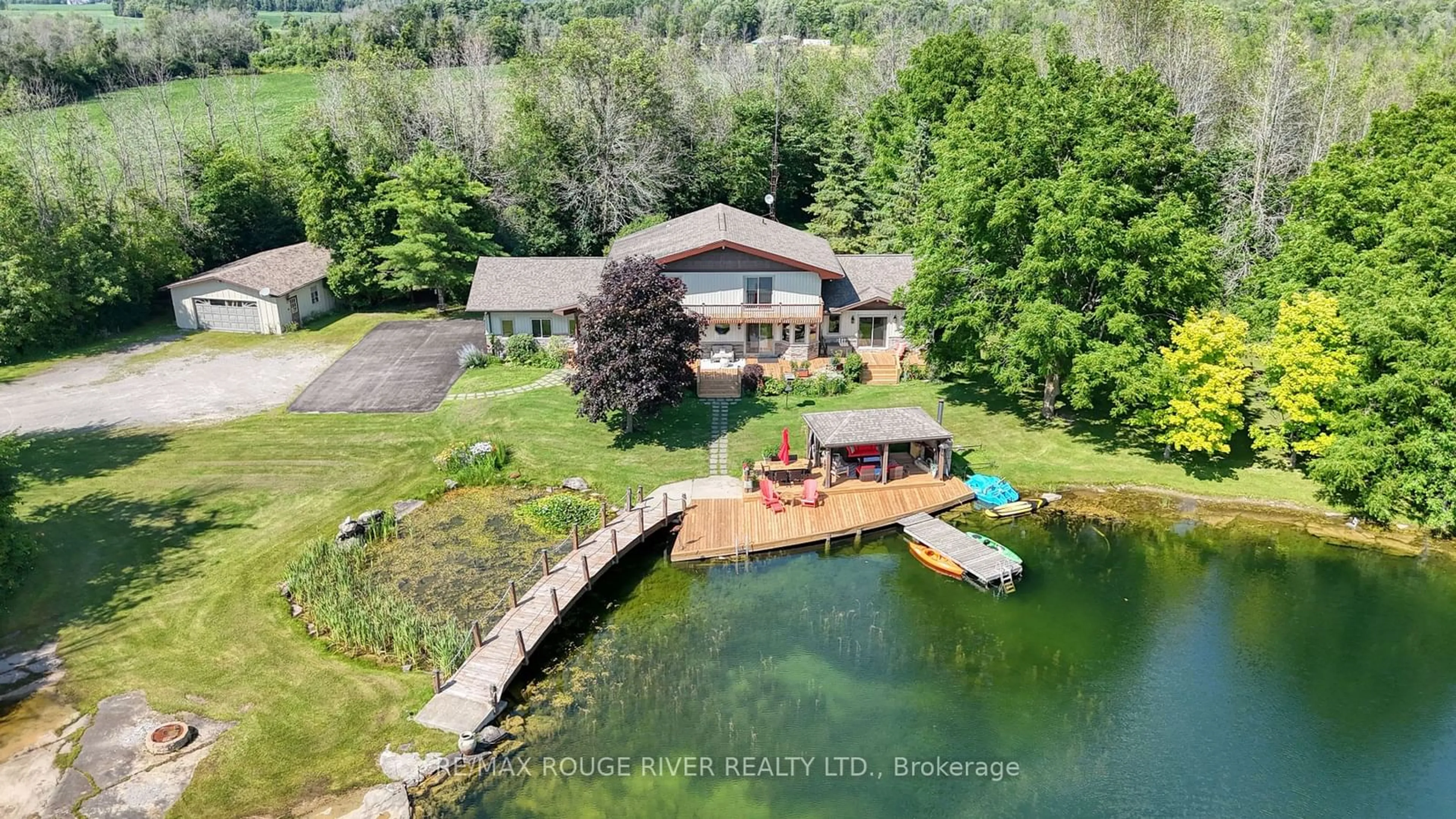 A pic from outside/outdoor area/front of a property/back of a property/a pic from drone, water/lake/river/ocean view for 908 County Rd 42 Rd, Athens Ontario K0E 1B0