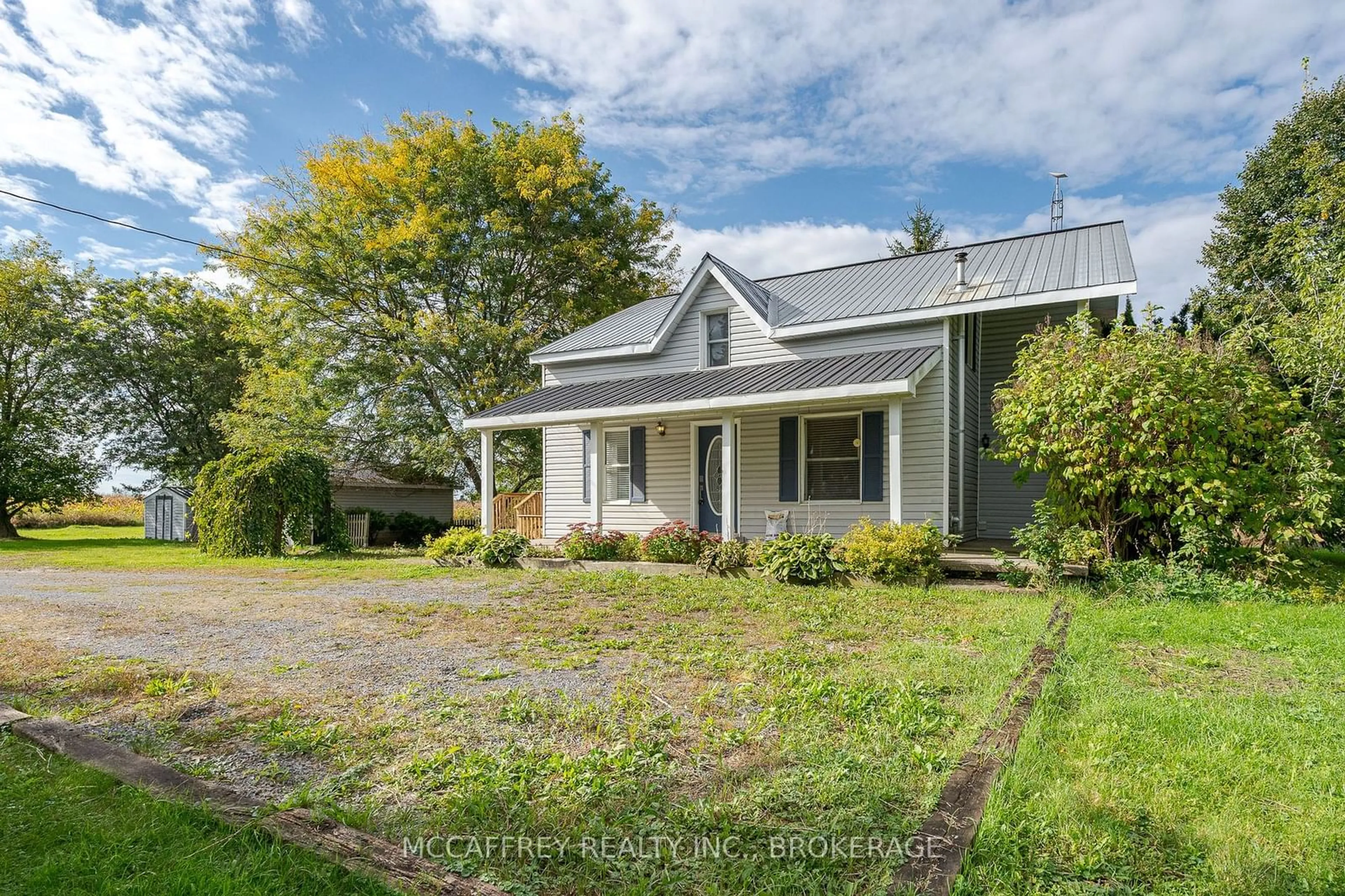 A pic from outside/outdoor area/front of a property/back of a property/a pic from drone, street for 1112 COUNTY RD 7, Loyalist Ontario K7R 3K6