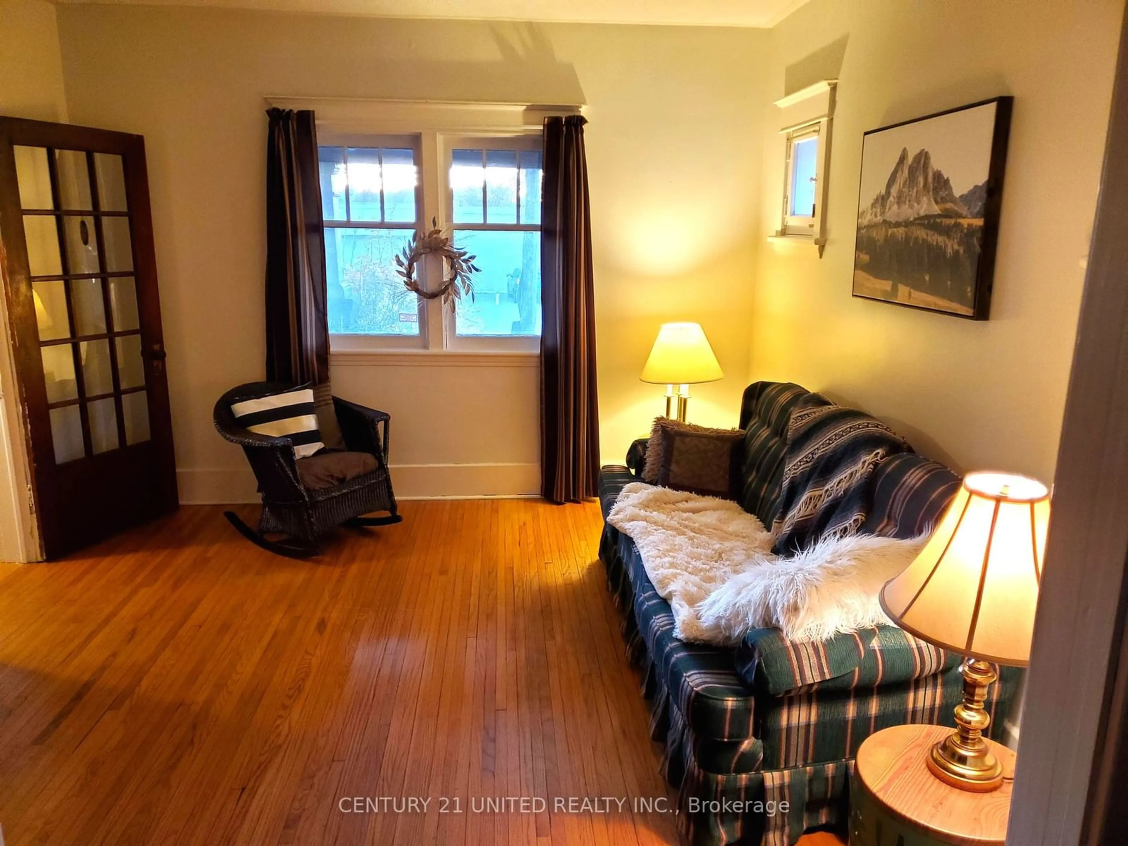 Living room with furniture, wood/laminate floor for 416 Rogers St, Peterborough Ontario K9H 1W9