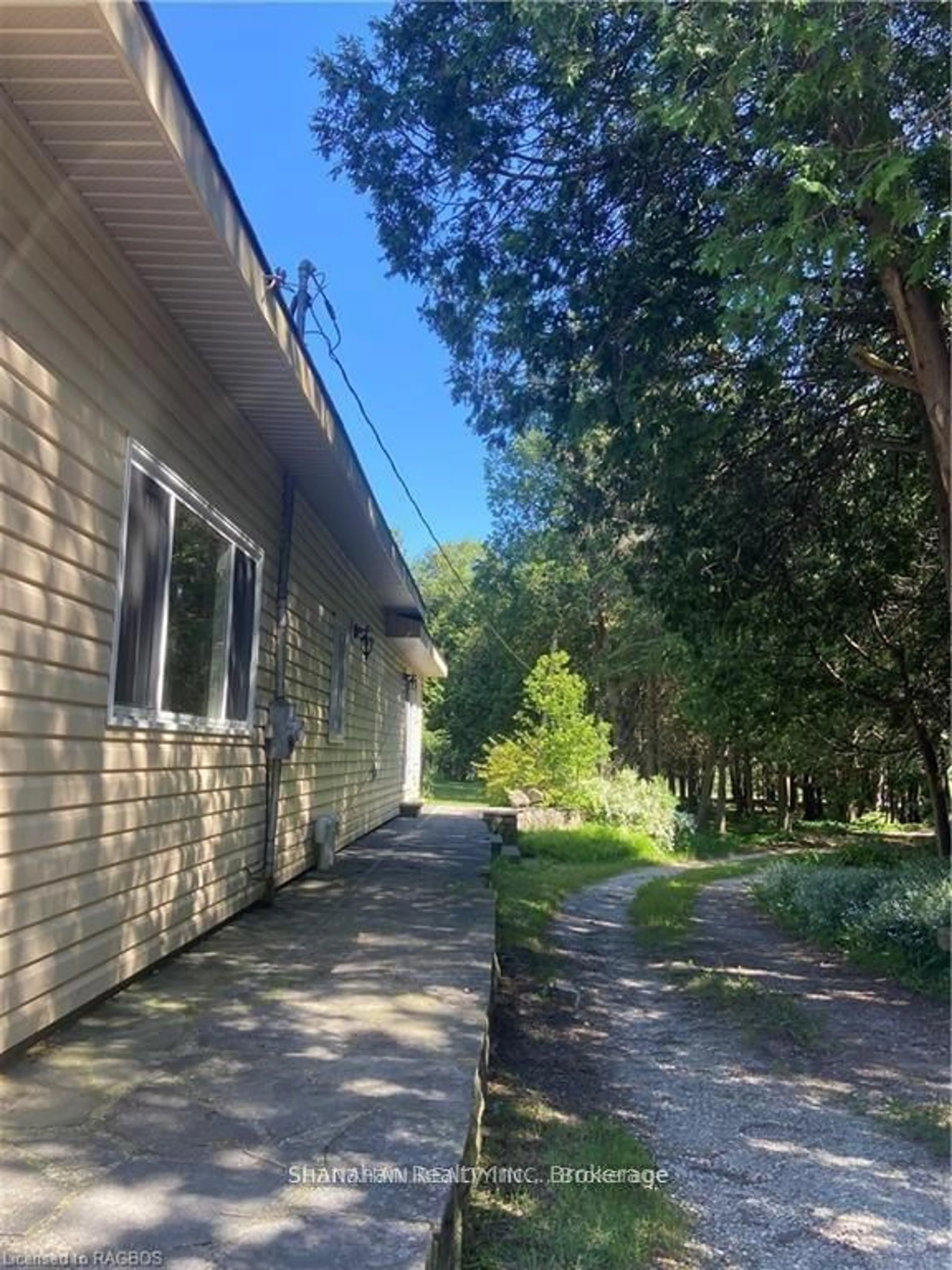 A pic from outside/outdoor area/front of a property/back of a property/a pic from drone, forest/trees view for 17 Little Cove Rd, Northern Bruce Peninsula Ontario N0H 2R0