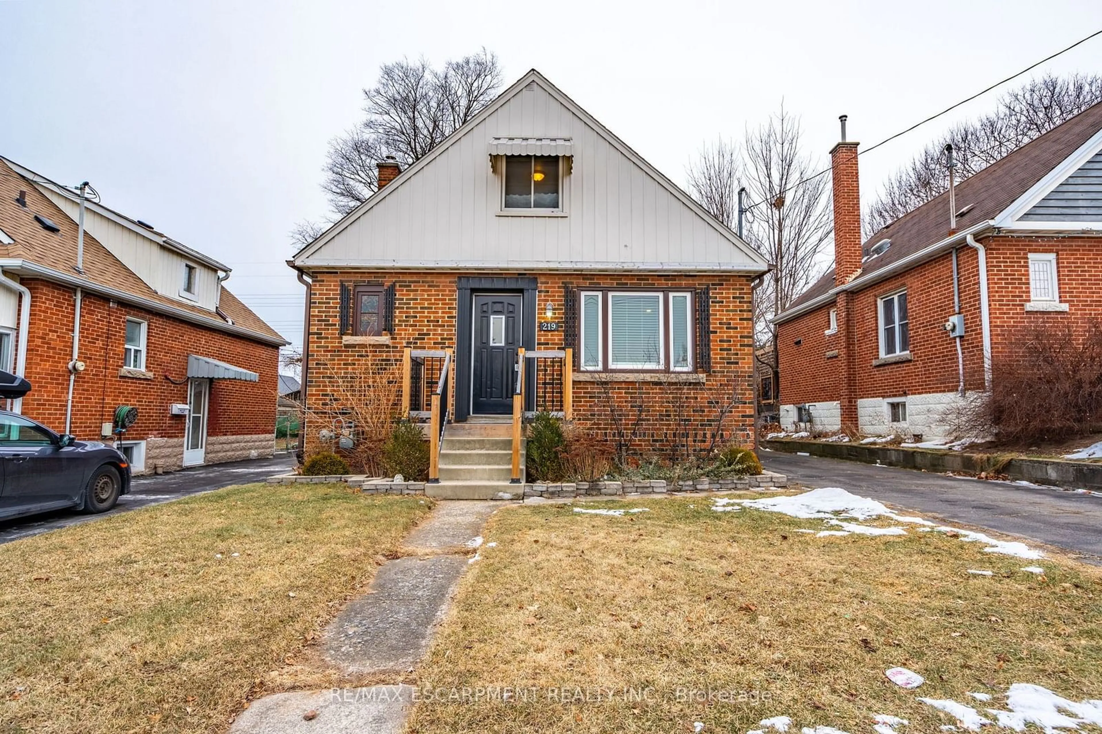 Home with brick exterior material, street for 219 RODGERS Rd, Hamilton Ontario L8K 3C3