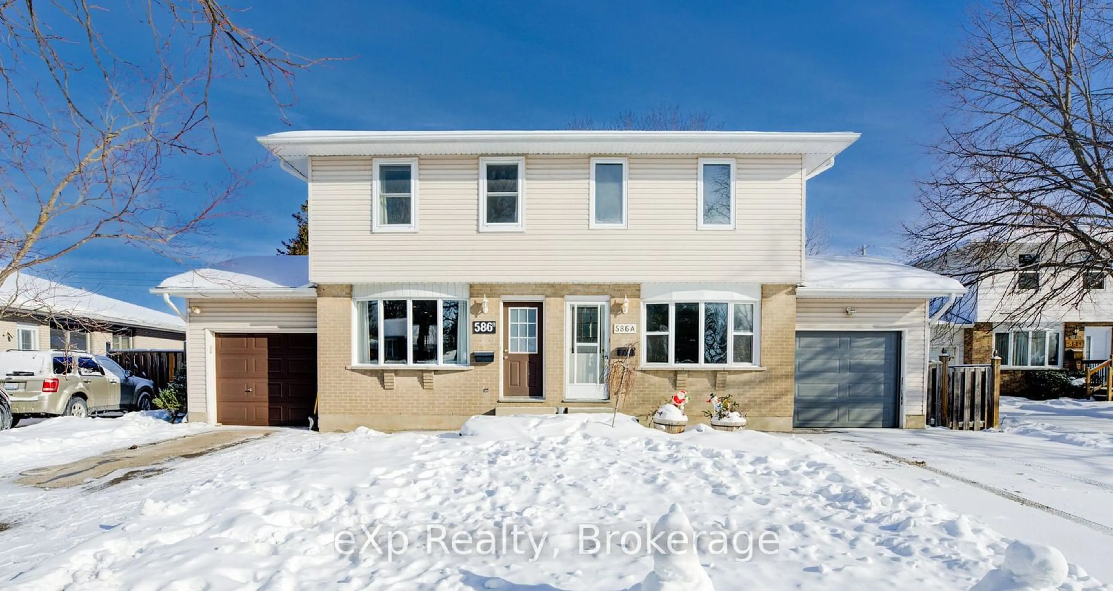 Home with brick exterior material, street for 586 Mount Anne Dr #B, Waterloo Ontario N2L 4W3