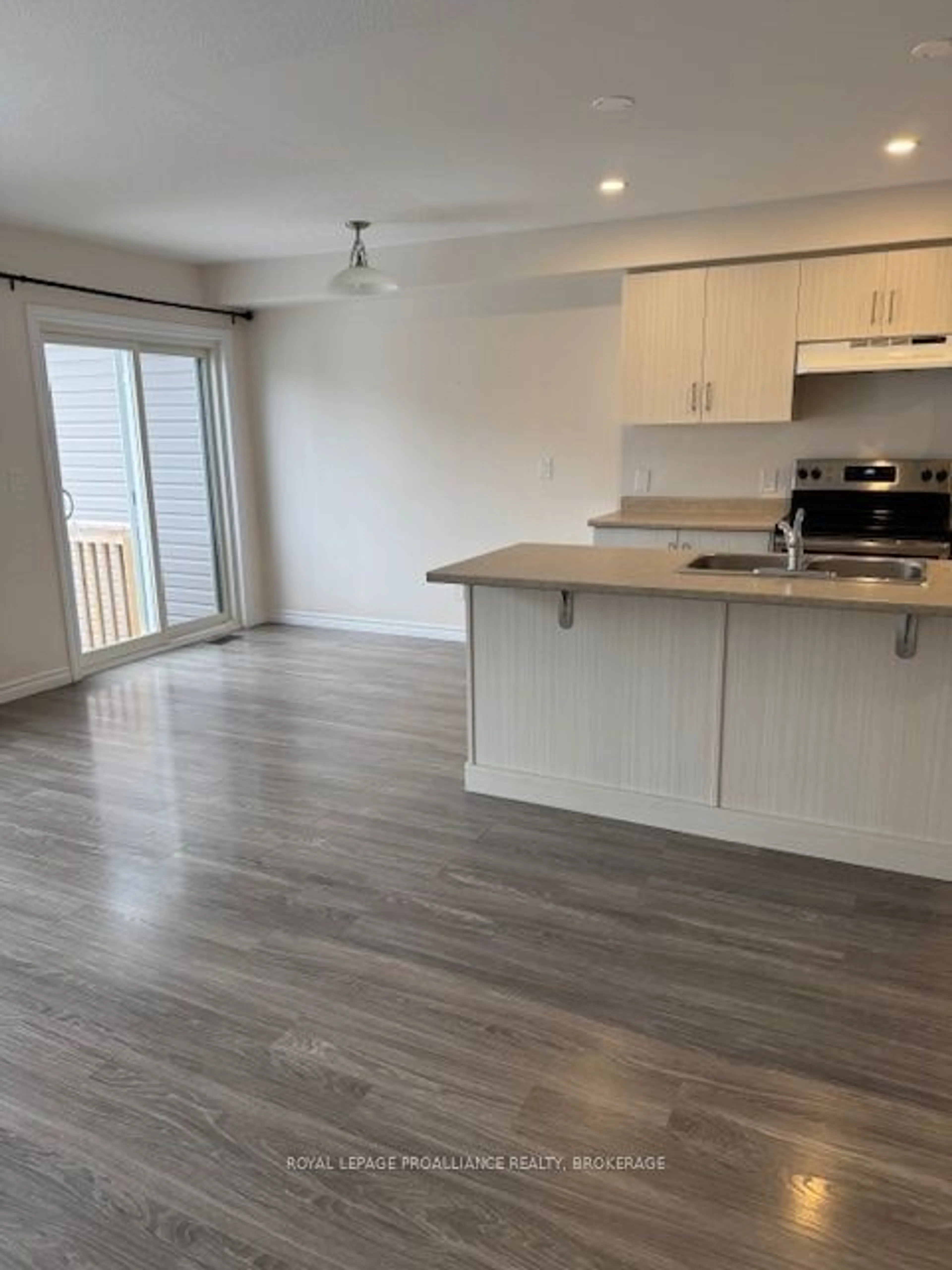 Open concept kitchen, wood/laminate floor for 1458 Monarch Dr, Kingston Ontario K7P 0R8