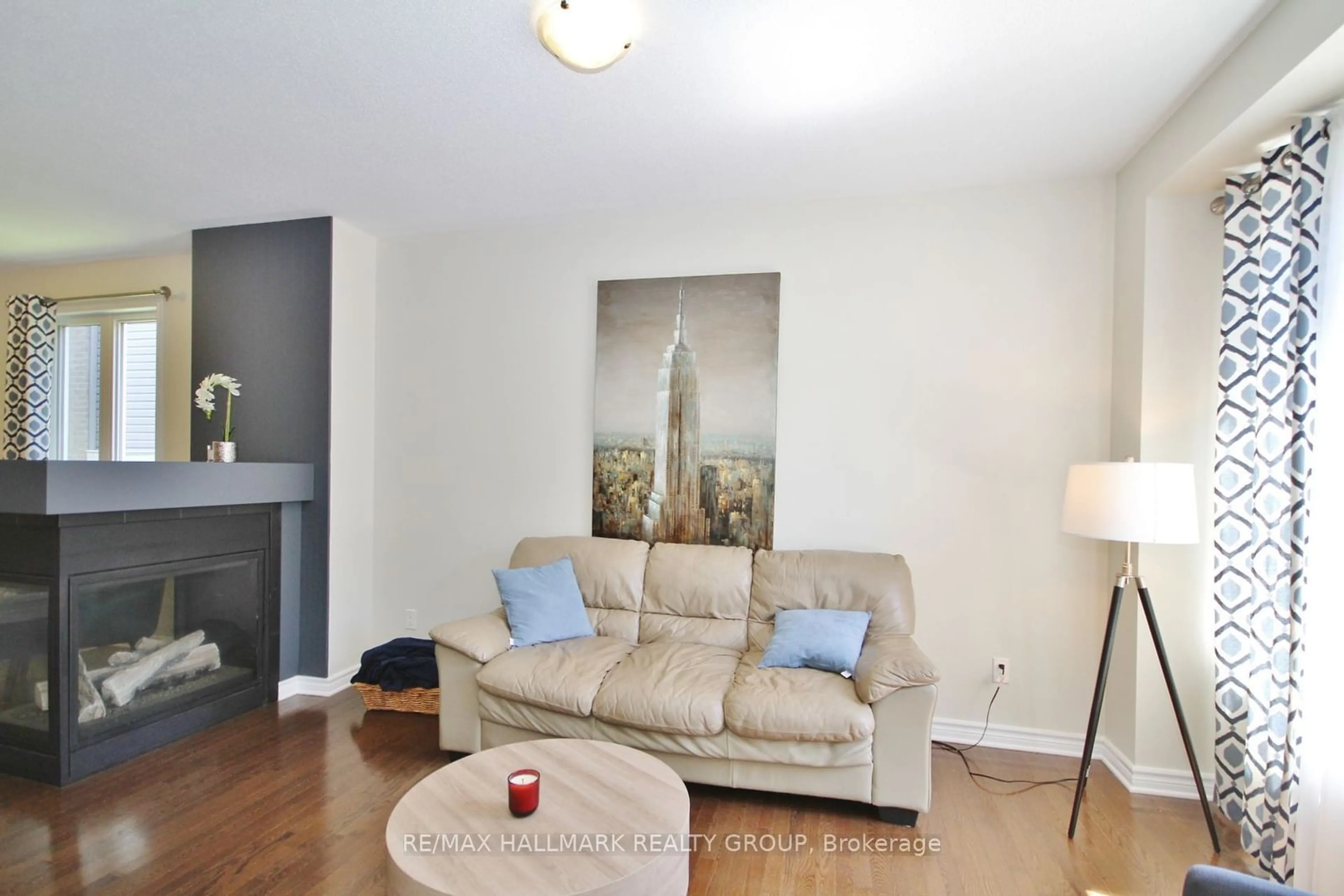 Living room with furniture, wood/laminate floor for 120 Manorwood Cres, Blossom Park - Airport and Area Ontario K1T 0L4