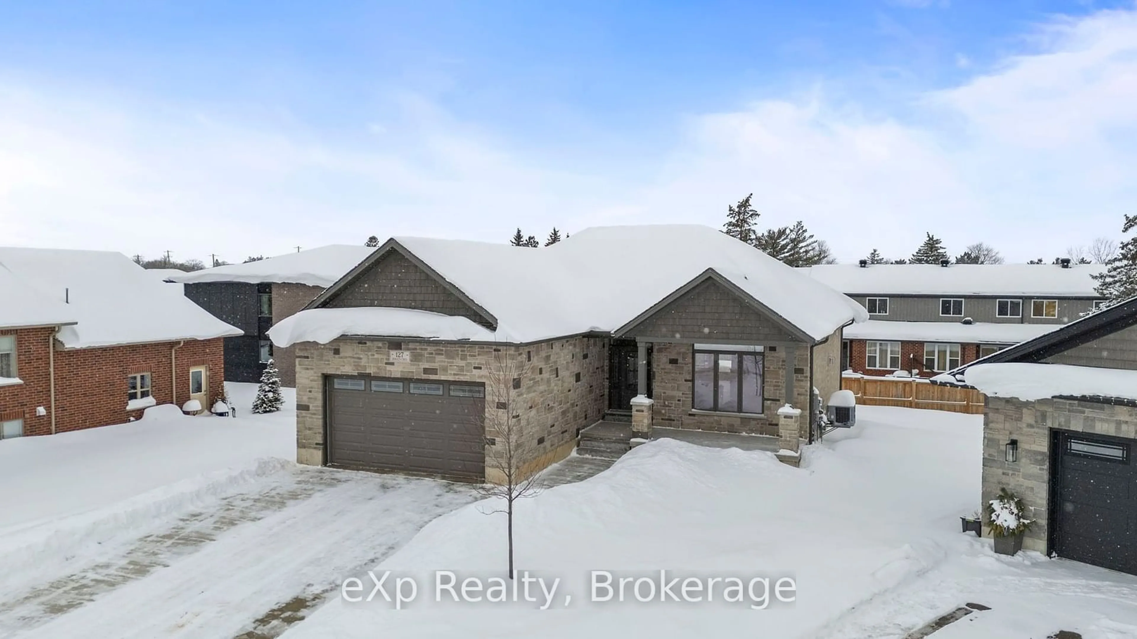 A pic from outside/outdoor area/front of a property/back of a property/a pic from drone, street for 127 DOUGS Cres, Wellington North Ontario N0G 2L4