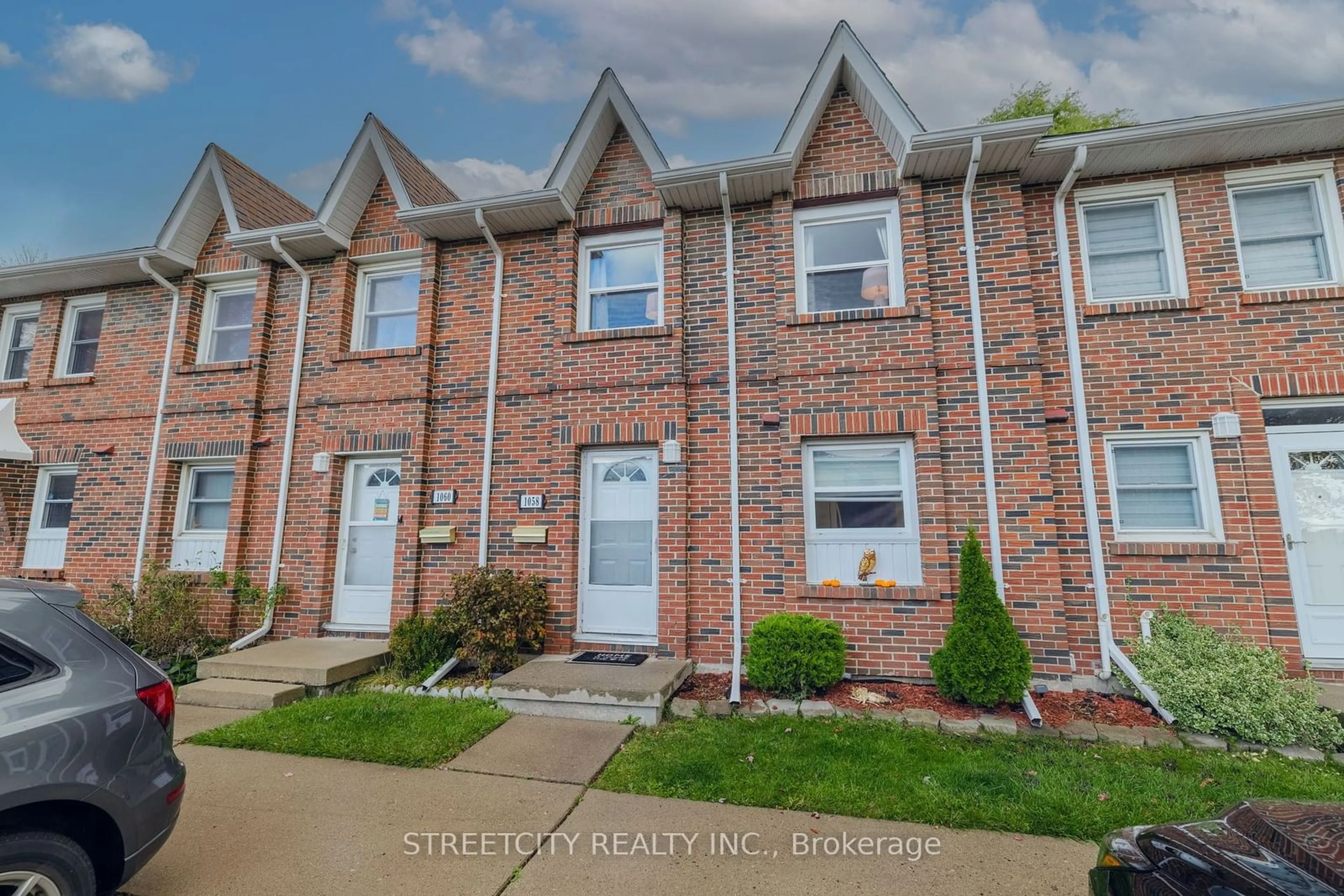 Home with brick exterior material, street for 1058 Southdale Rd, London Ontario N6E 1B2