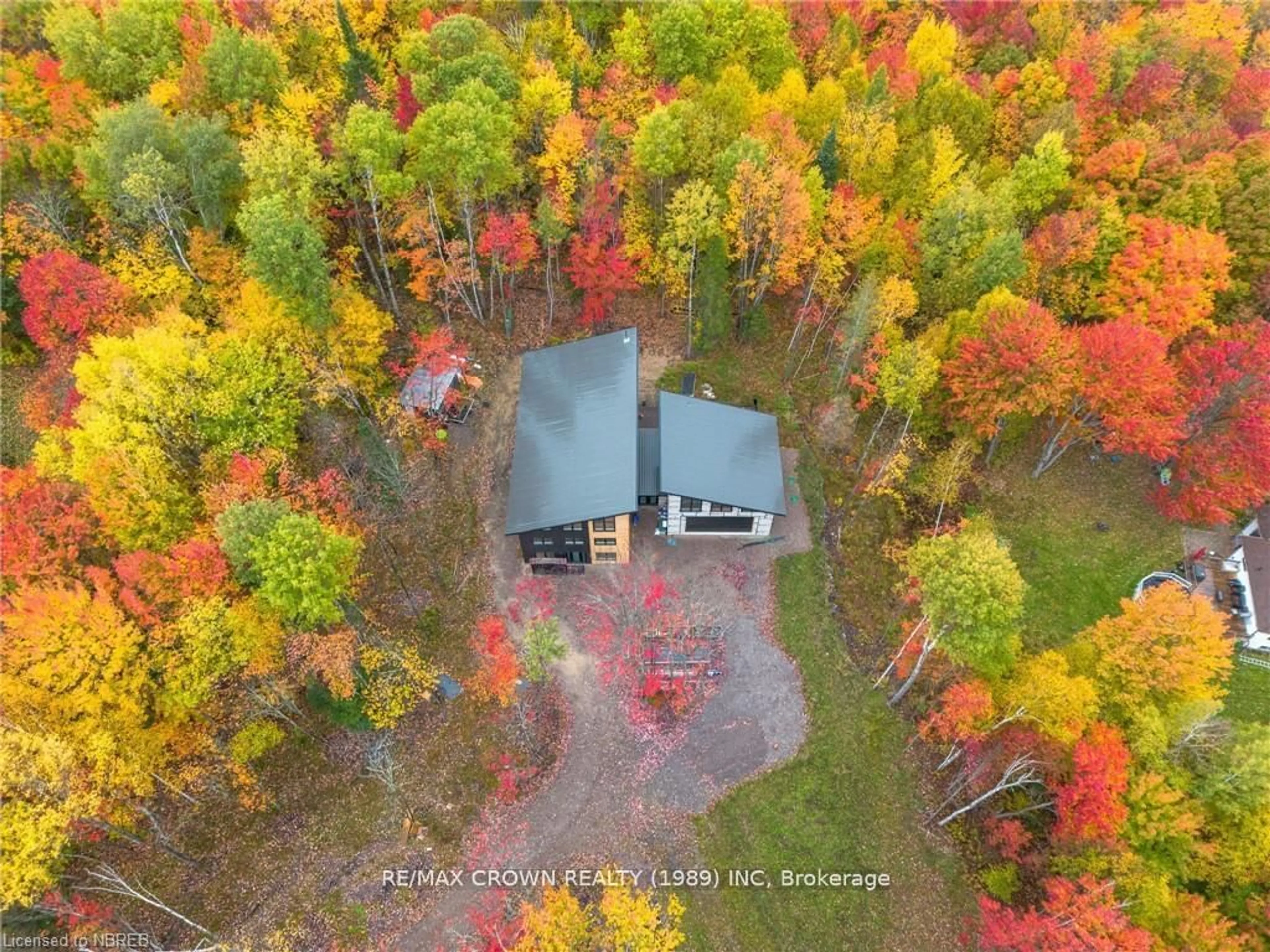 A pic from outside/outdoor area/front of a property/back of a property/a pic from drone, forest/trees view for 24 Sun Valley Way, Nipissing Ontario P0H 1Z0