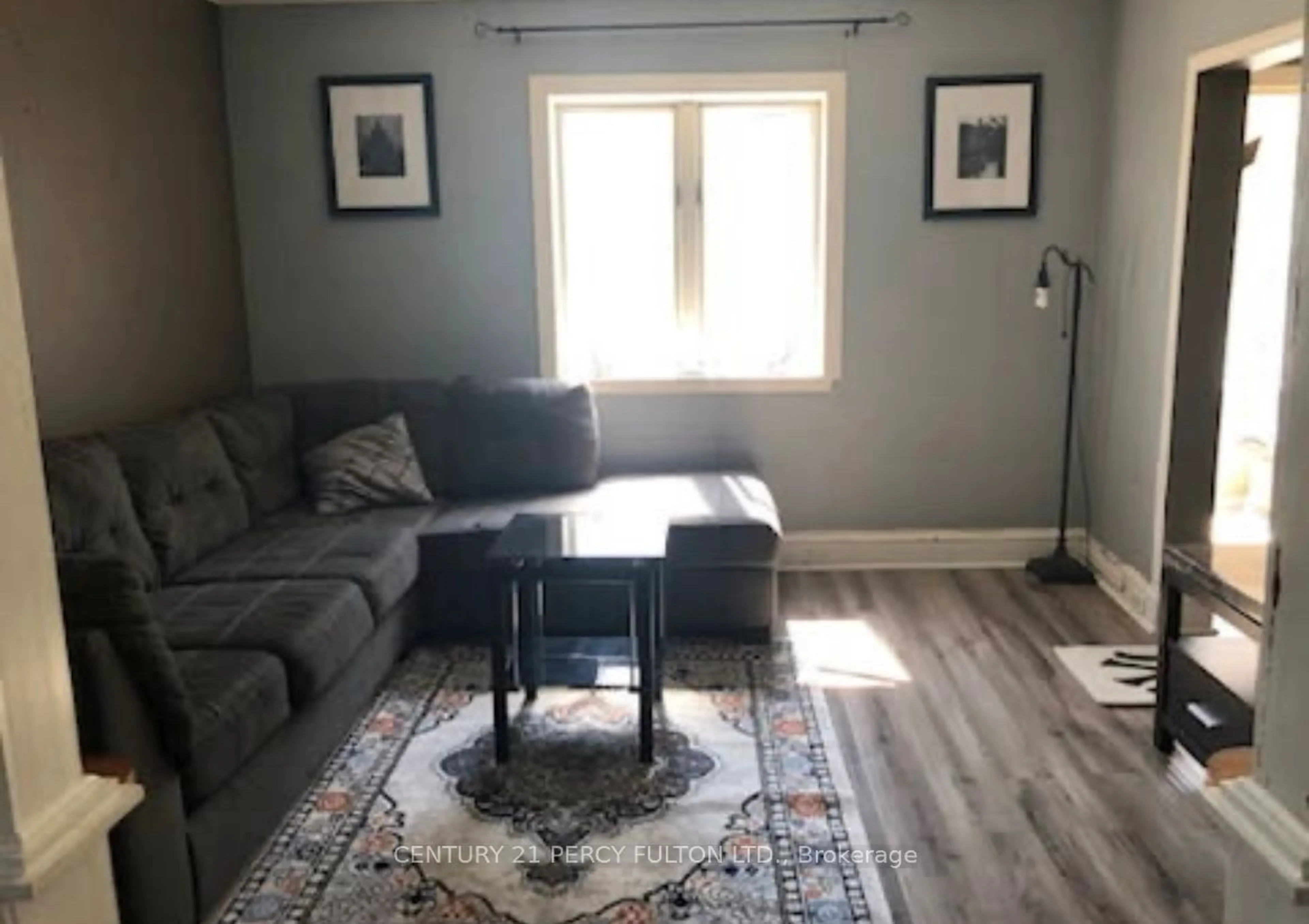 Living room with furniture, wood/laminate floor for 25 Burwash St, Arnprior Ontario K7S 1V1