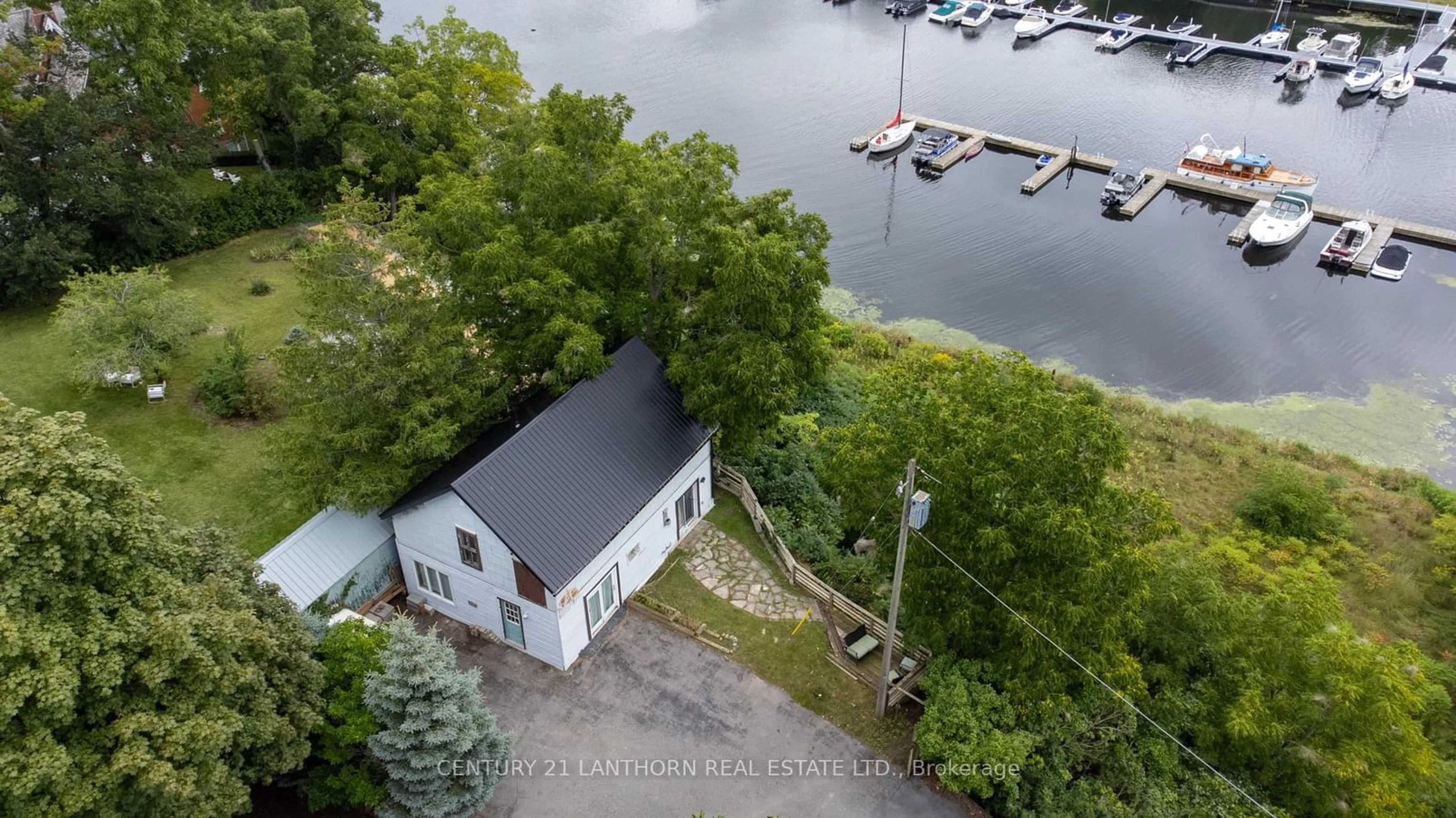 A pic from outside/outdoor area/front of a property/back of a property/a pic from drone, water/lake/river/ocean view for 344 Picton Main St, Prince Edward County Ontario K0K 2T0