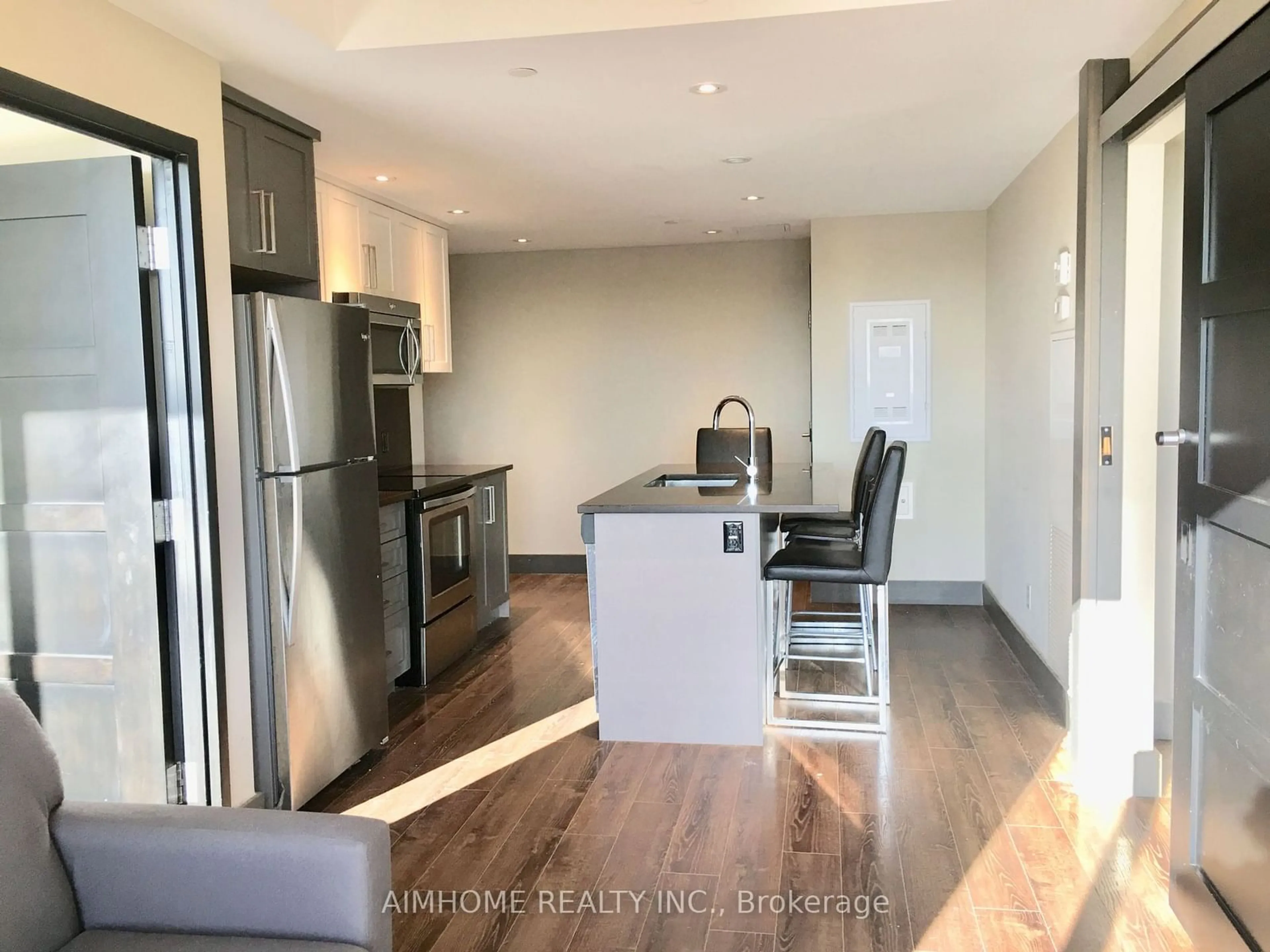 Open concept kitchen, wood/laminate floor for 330 Phillip St #S2702, Waterloo Ontario N2L 3W9